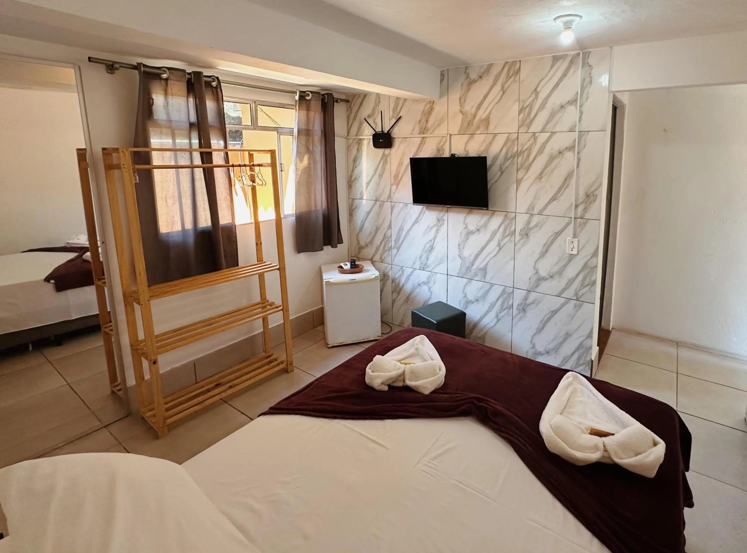 Bed in Pousada Ponta dos Corais