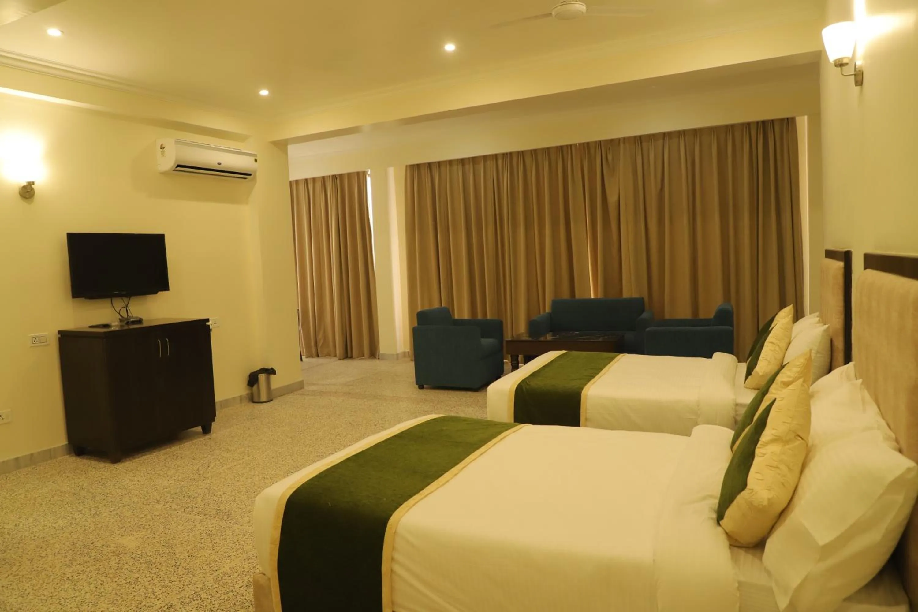 Bed in Gautam Hotels & Resorts