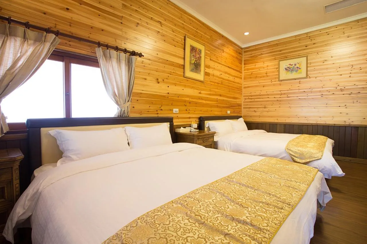 Bed in Zen and Pine Resort