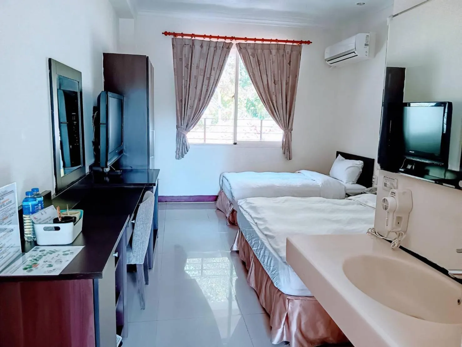 Bed in Zen and Pine Resort