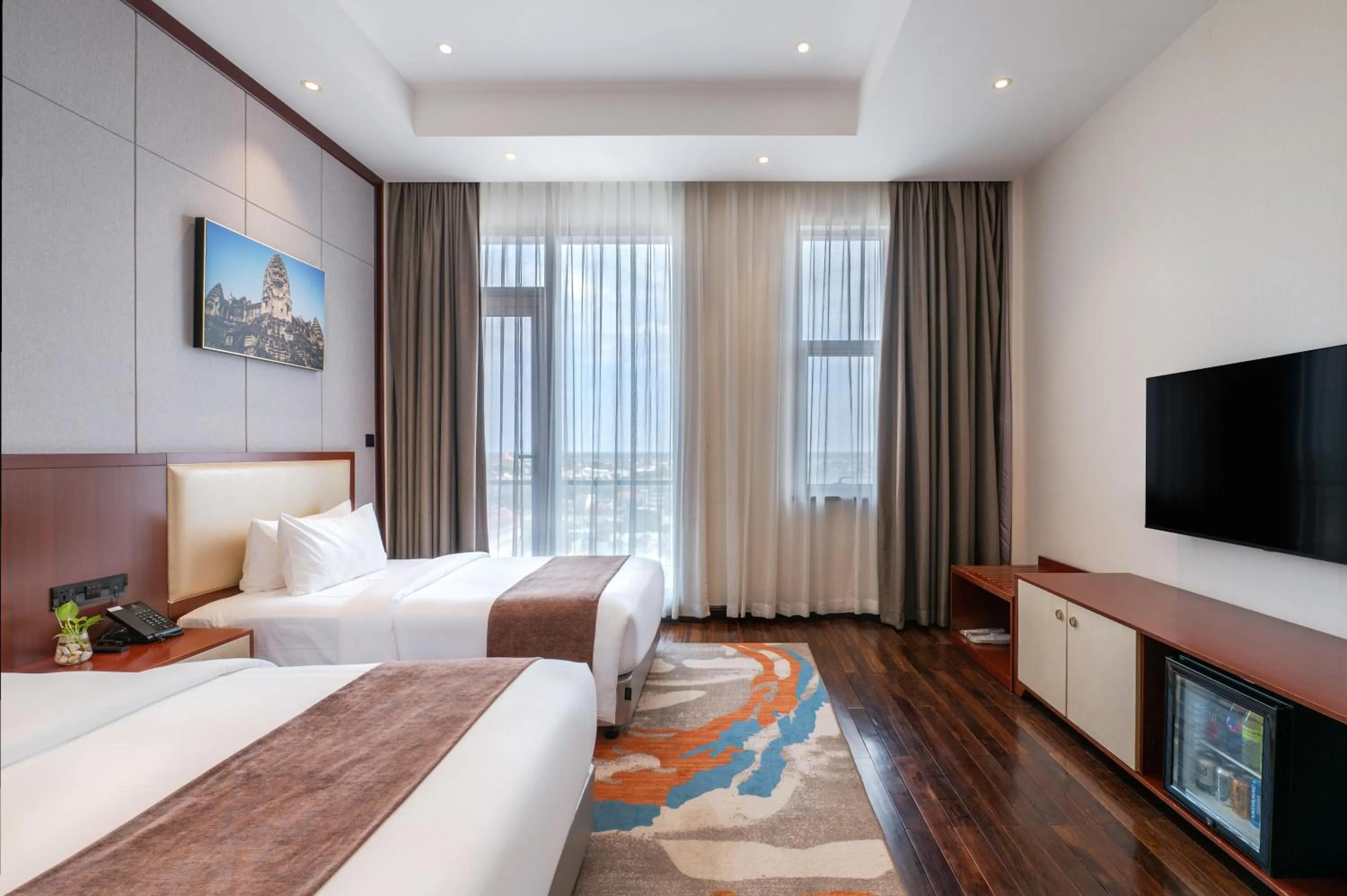 Bed in V V Hotel Battambang