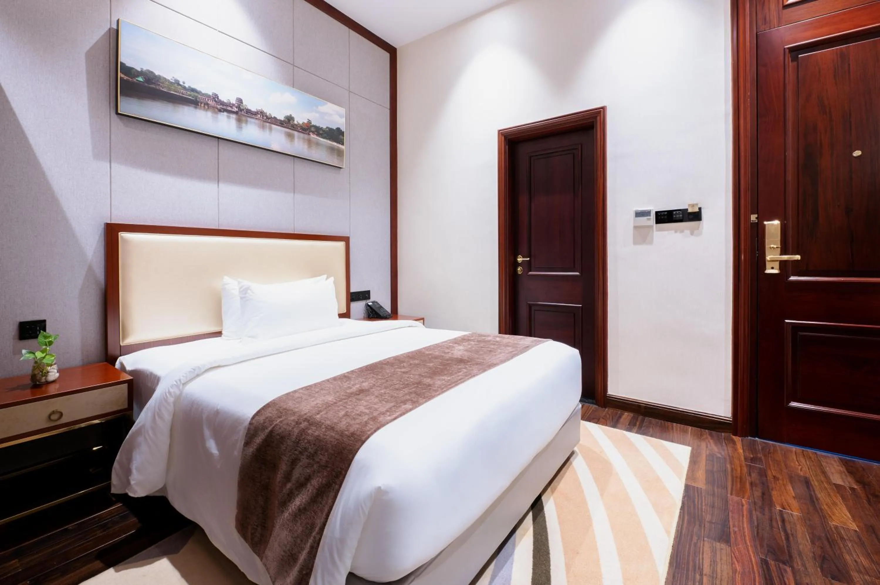 Bed in V V Hotel Battambang