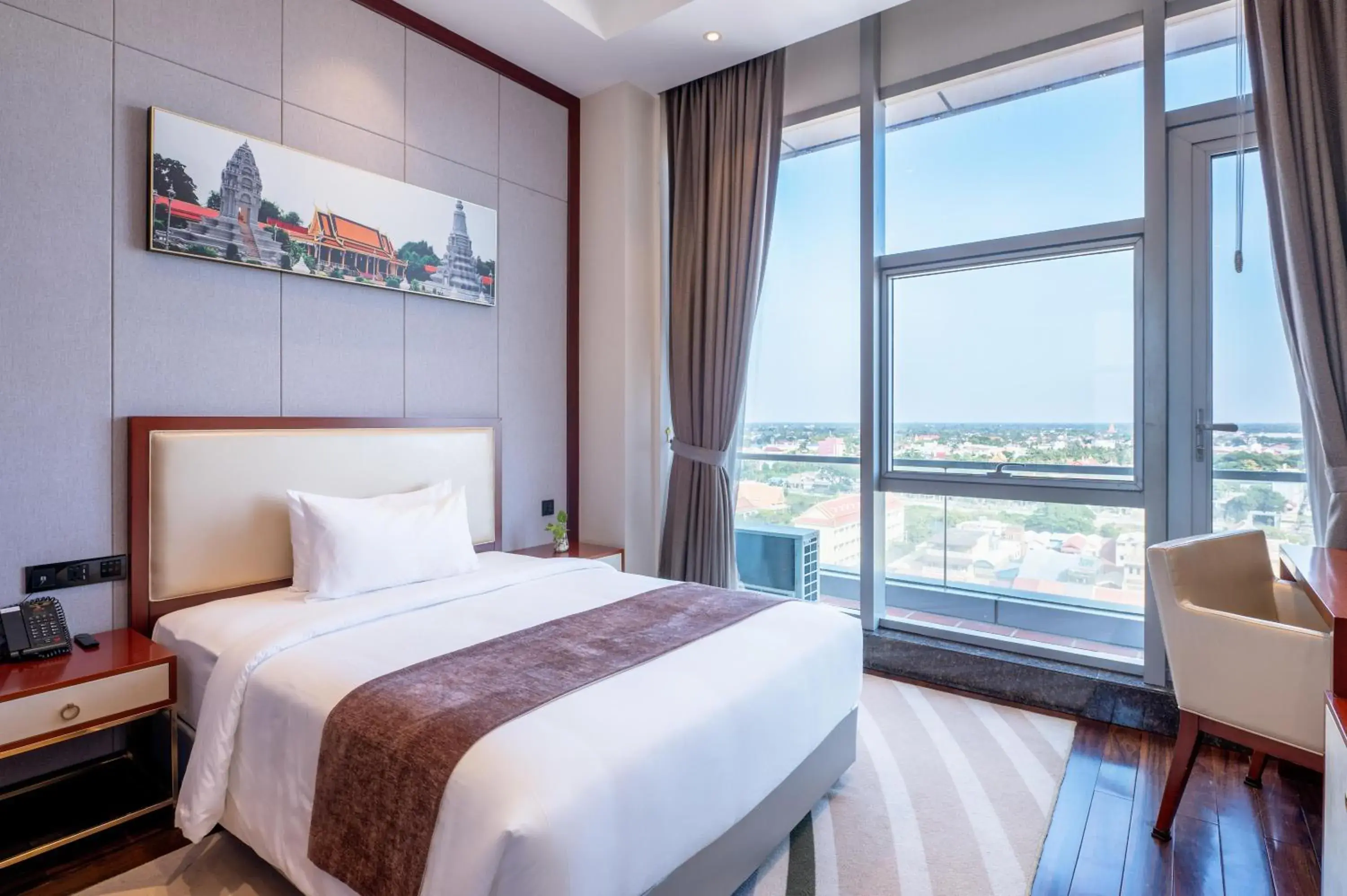 Bed in V V Hotel Battambang Bed in V V Hotel Battambang