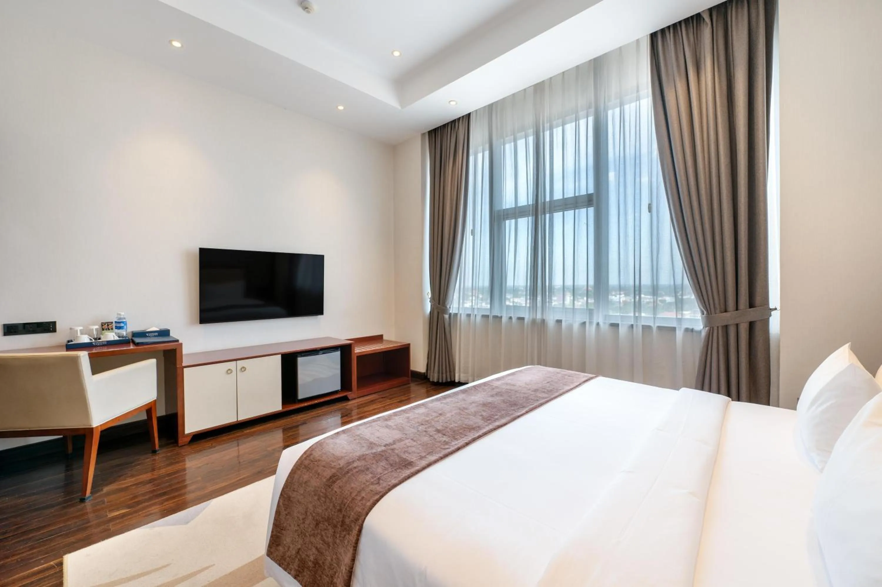 Bed in V V Hotel Battambang