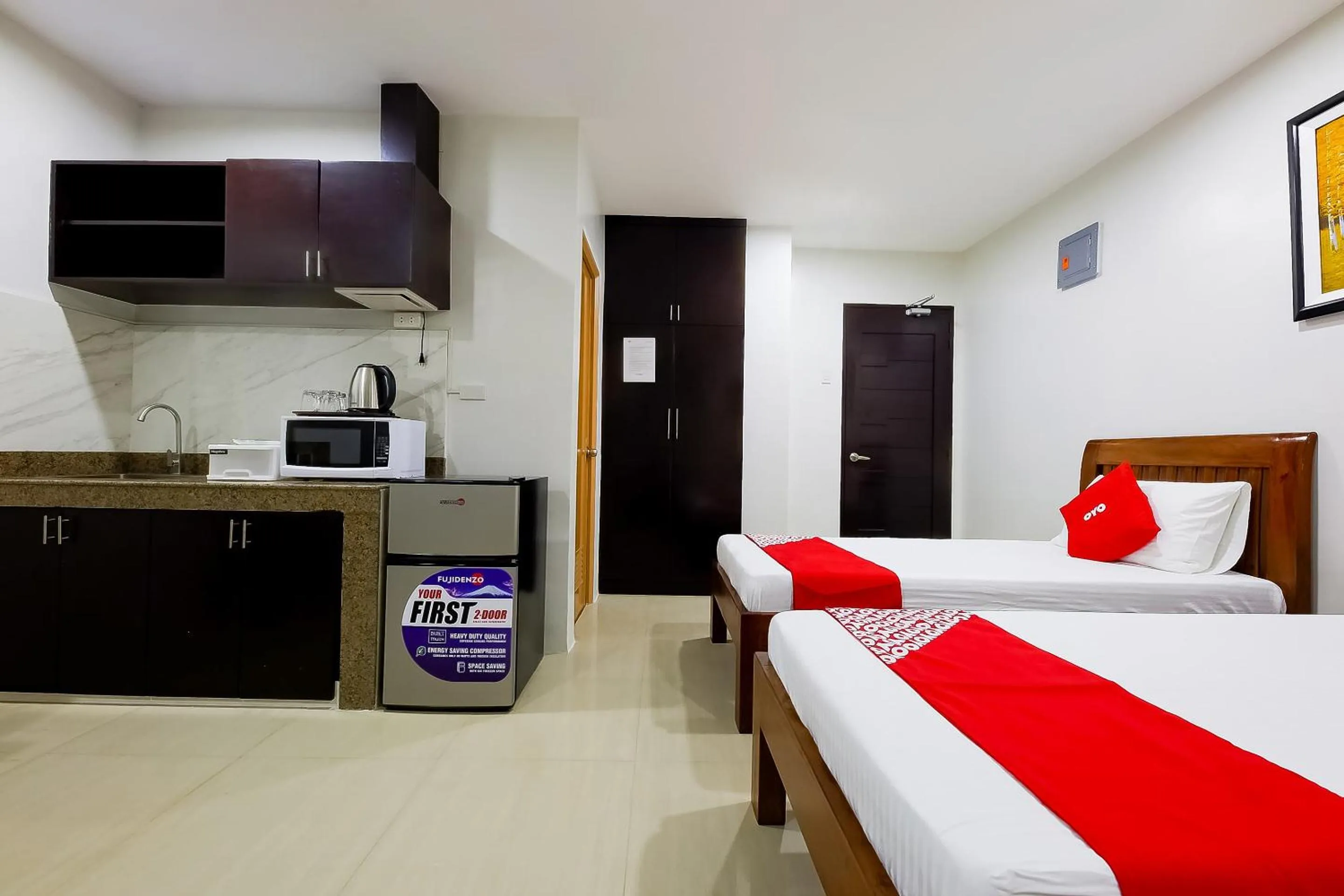 Bedroom in OYO 848 Dona Aurora Condotel