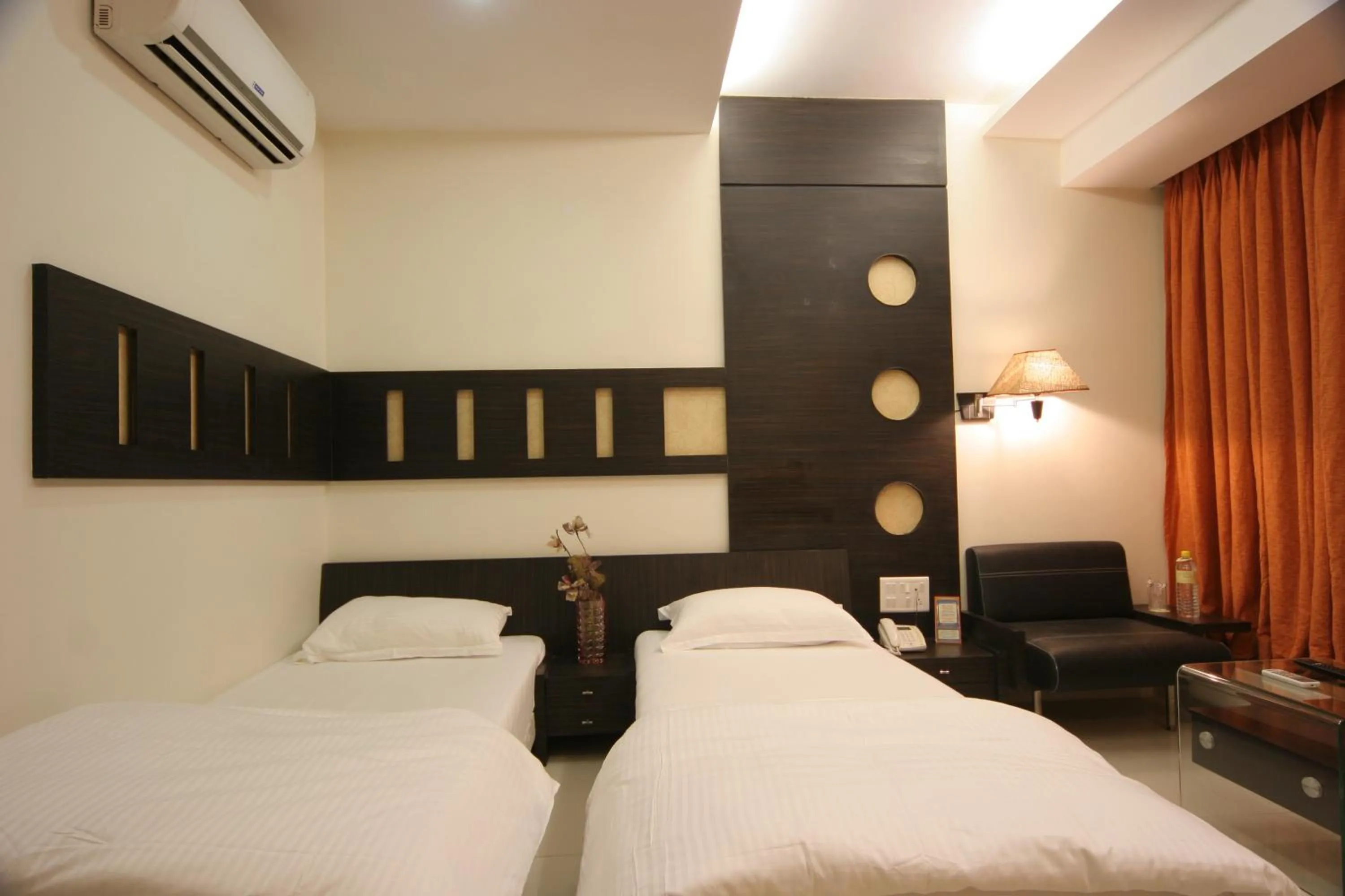 Photo of the whole room, Bed in Pride Biznotel Alkapuri Near Vadodara Airport