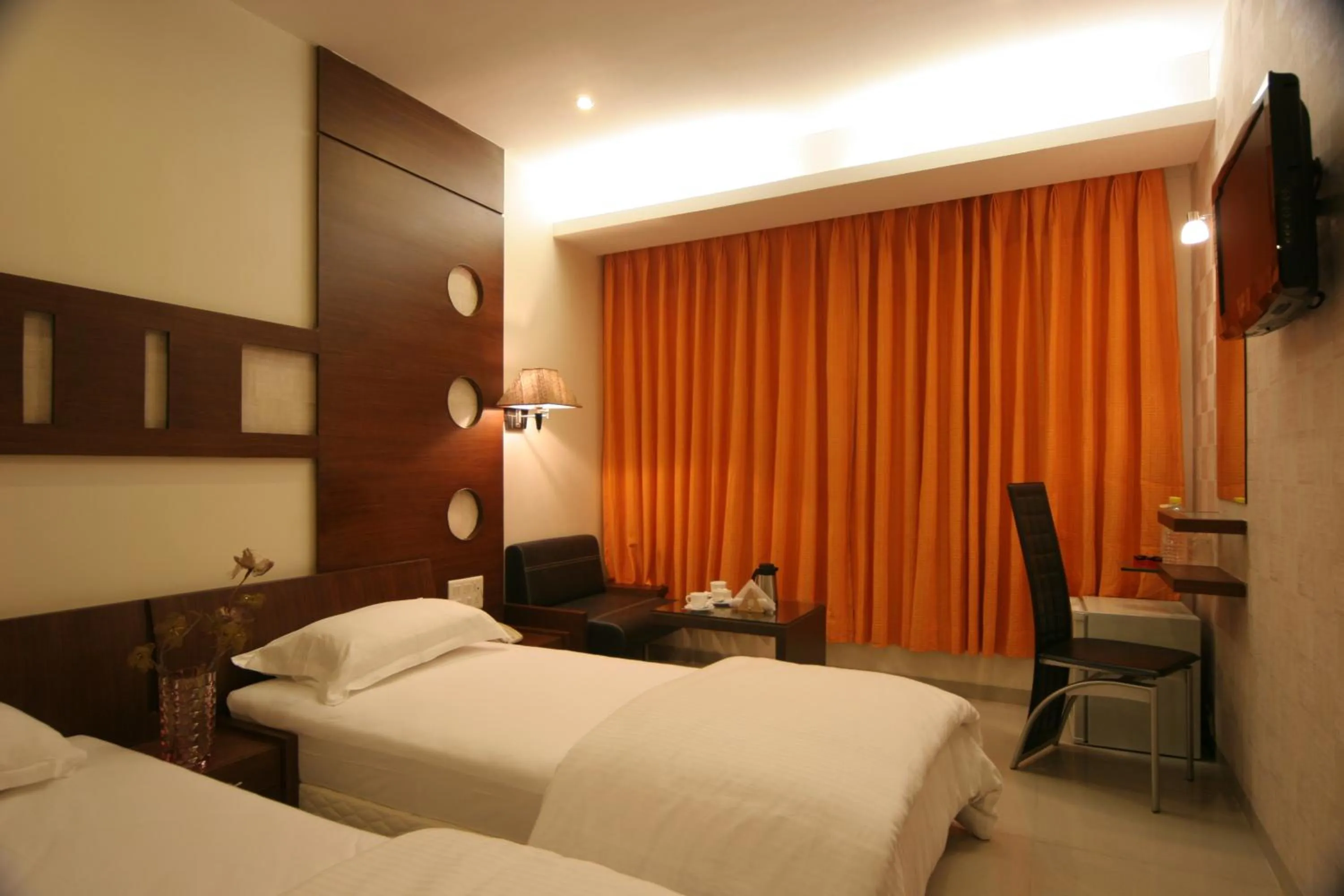 Photo of the whole room, Bed in Pride Biznotel Alkapuri Near Vadodara Airport