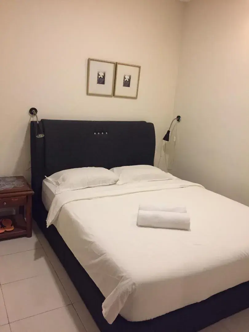 Bed in FKI INTERNATIONAL HOTEL