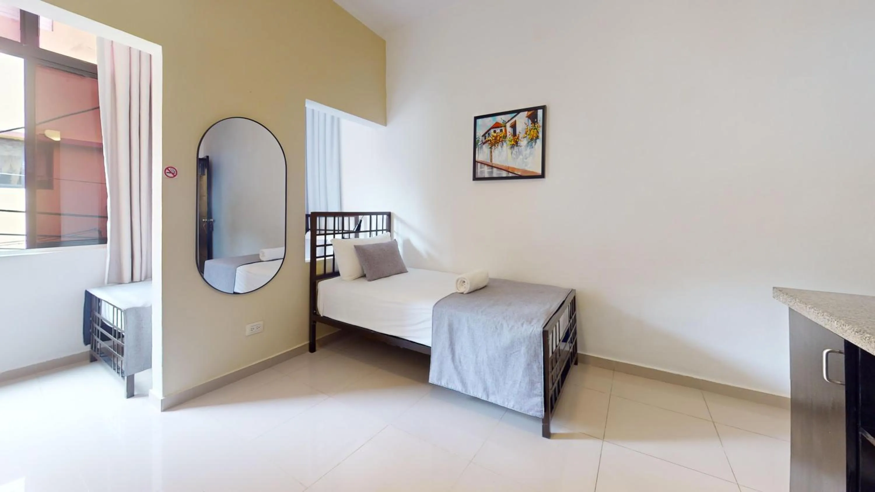 Bed in Hotel Tau Art Residence