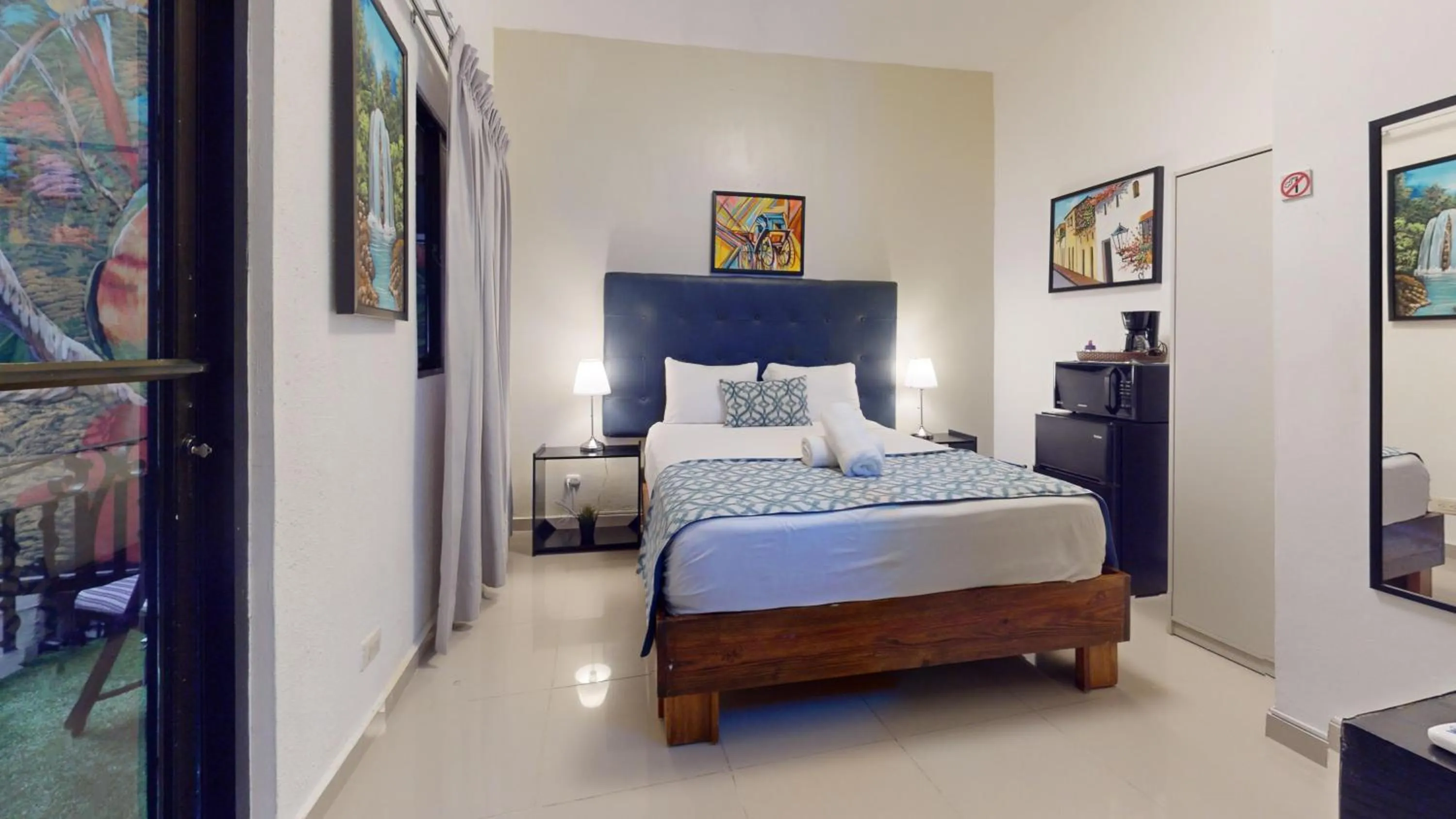 Bed in Hotel Tau Art Residence