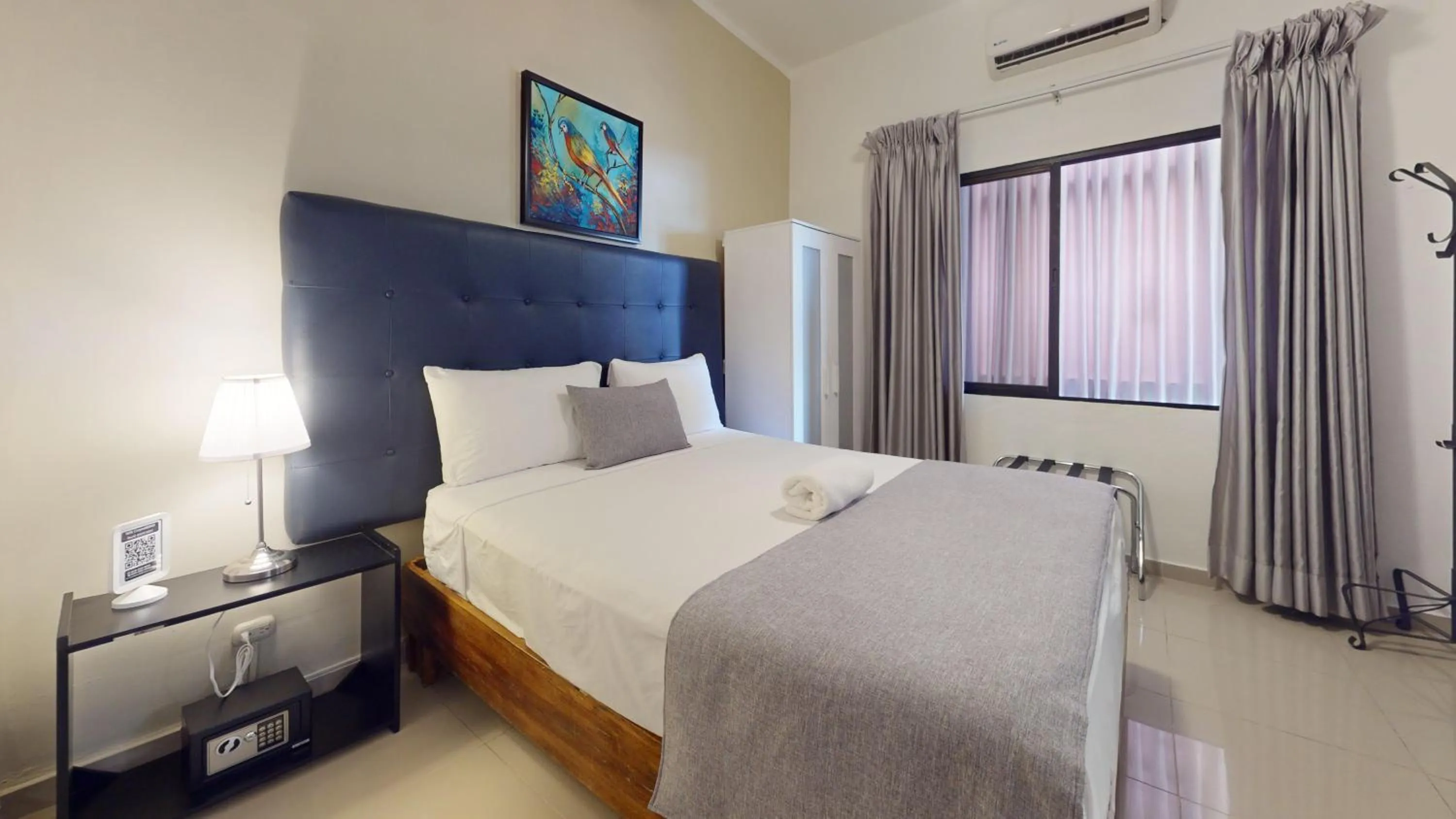 Bed in Hotel Tau Art Residence