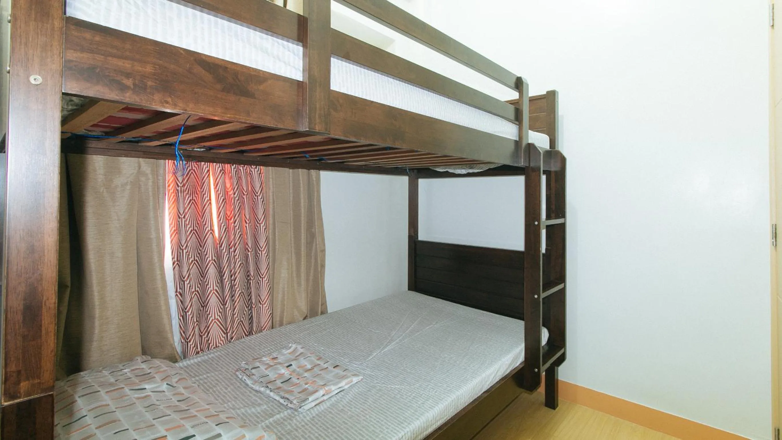 bunk bed in Jamah's Staycation at SMDC Trees Residences by RedDoorz