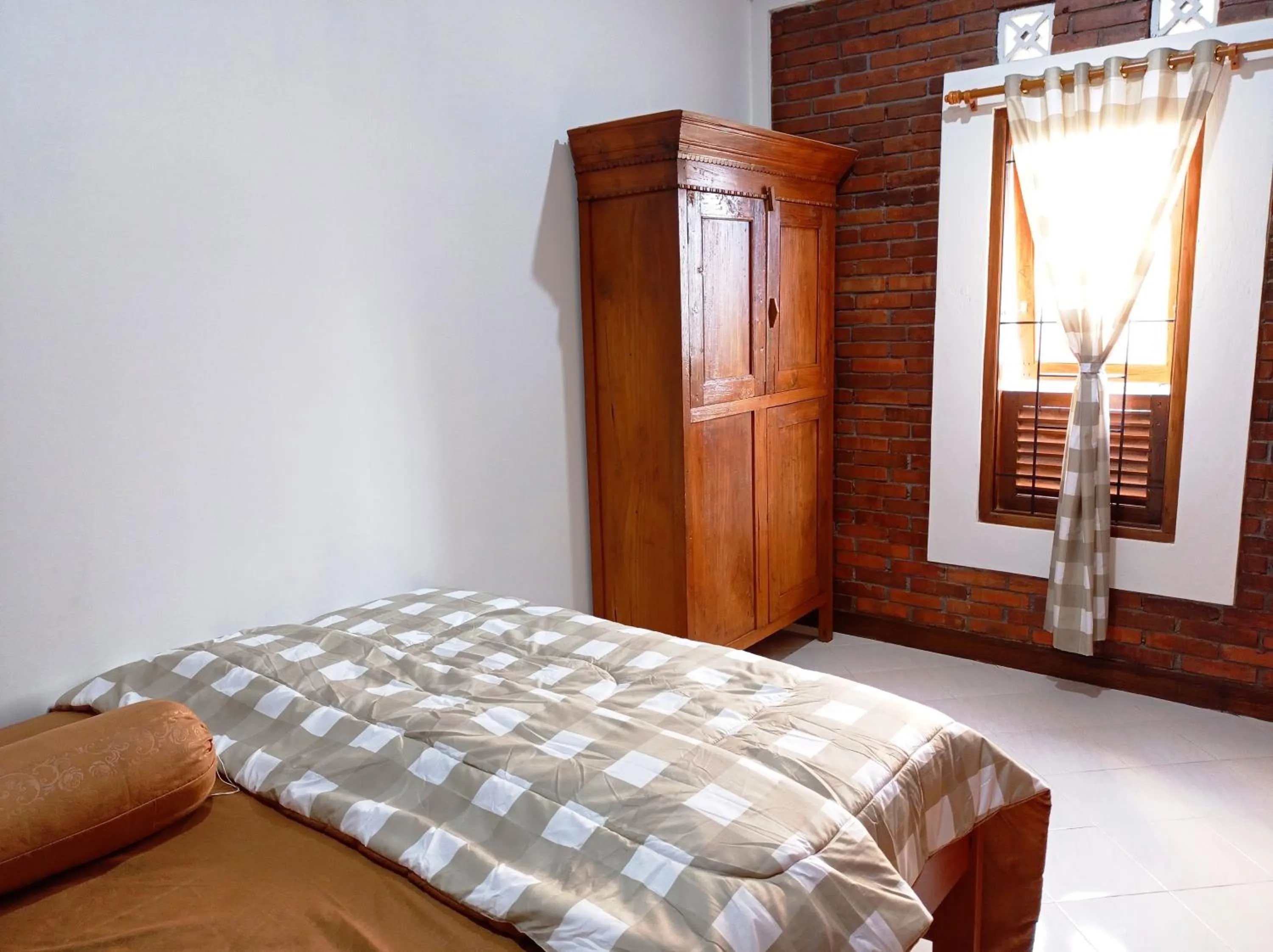 Bed in Angler Homestay & Joglo