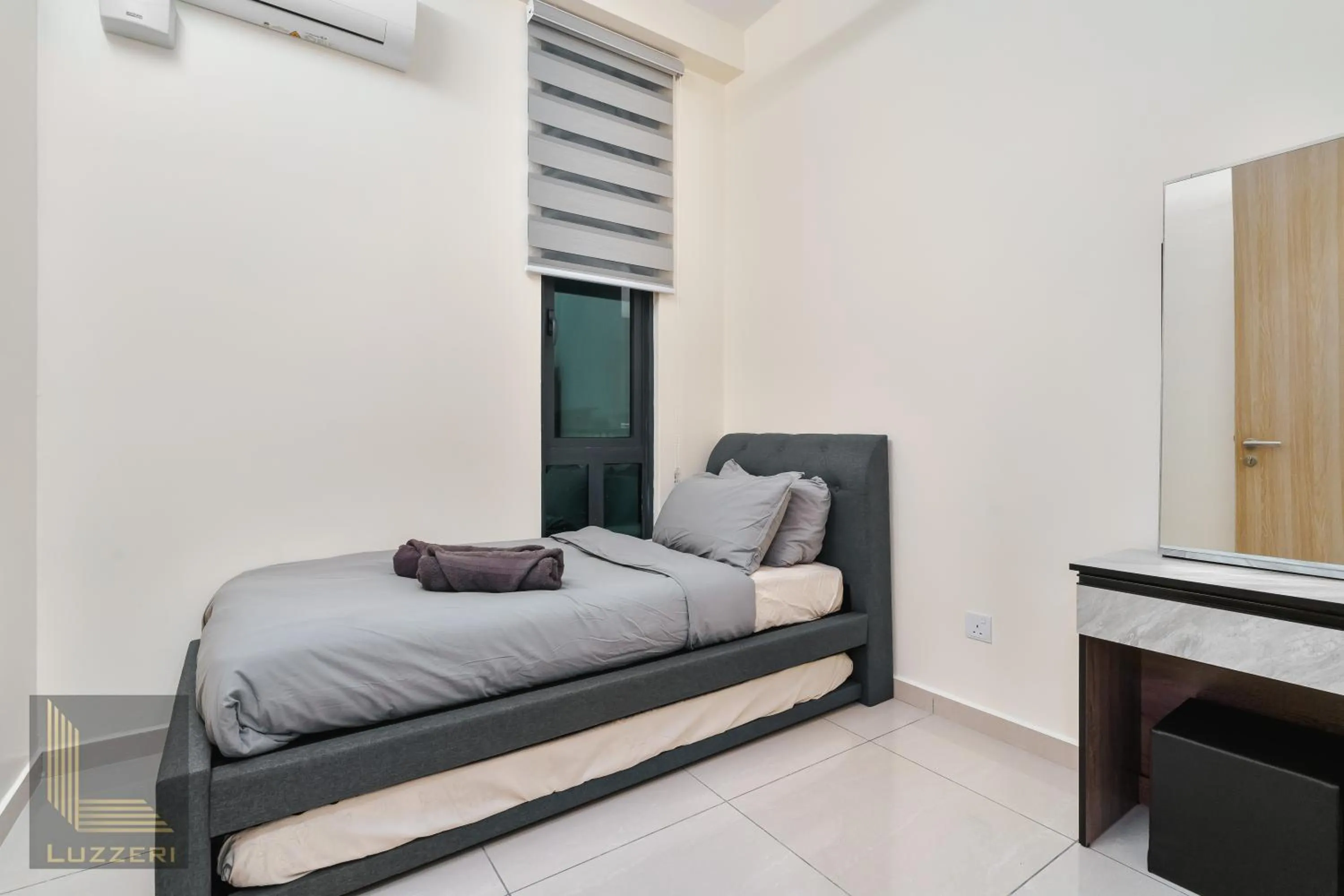 Bed in Legasi Kampung Baru Guesthouse