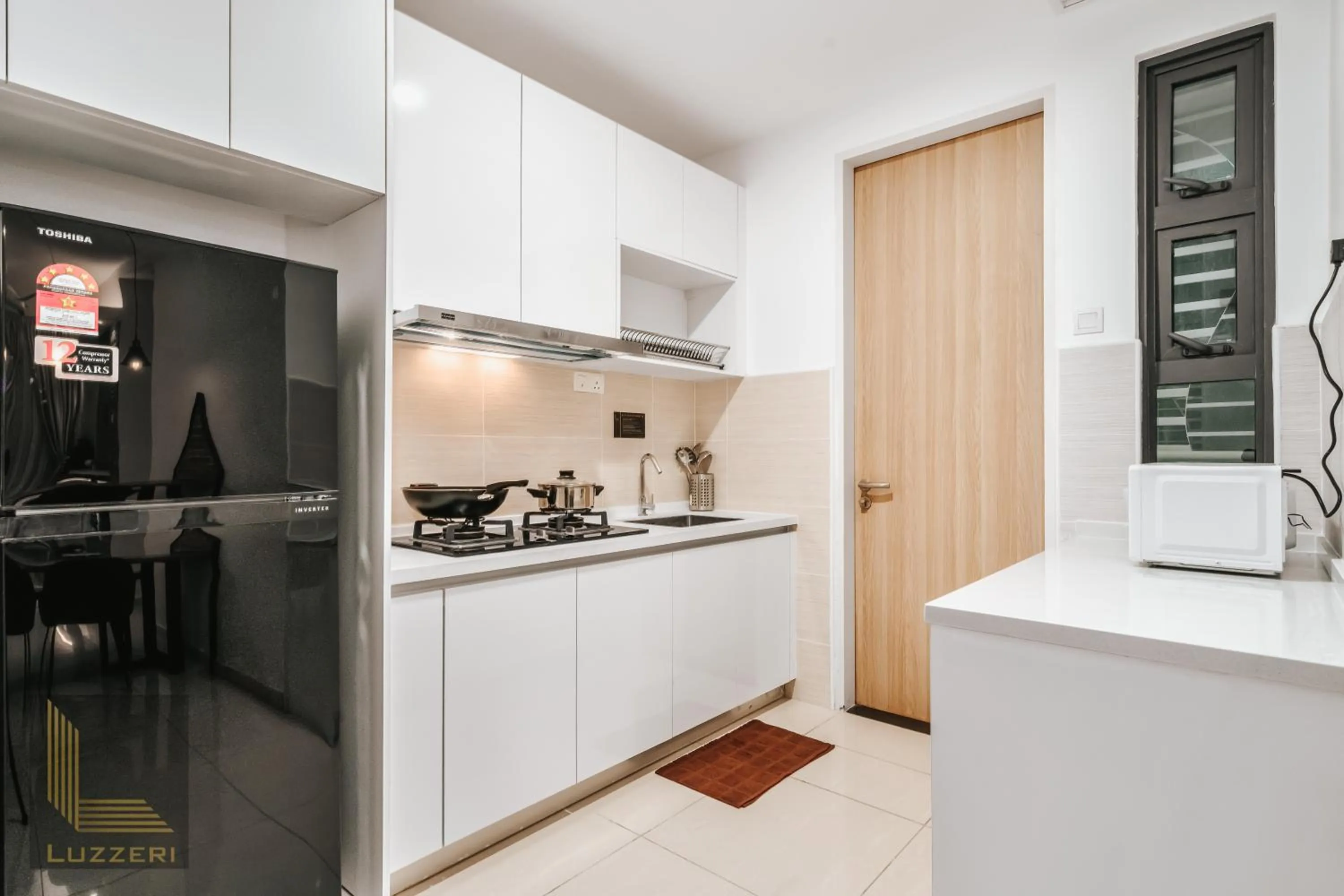 kitchen in Legasi Kampung Baru Guesthouse