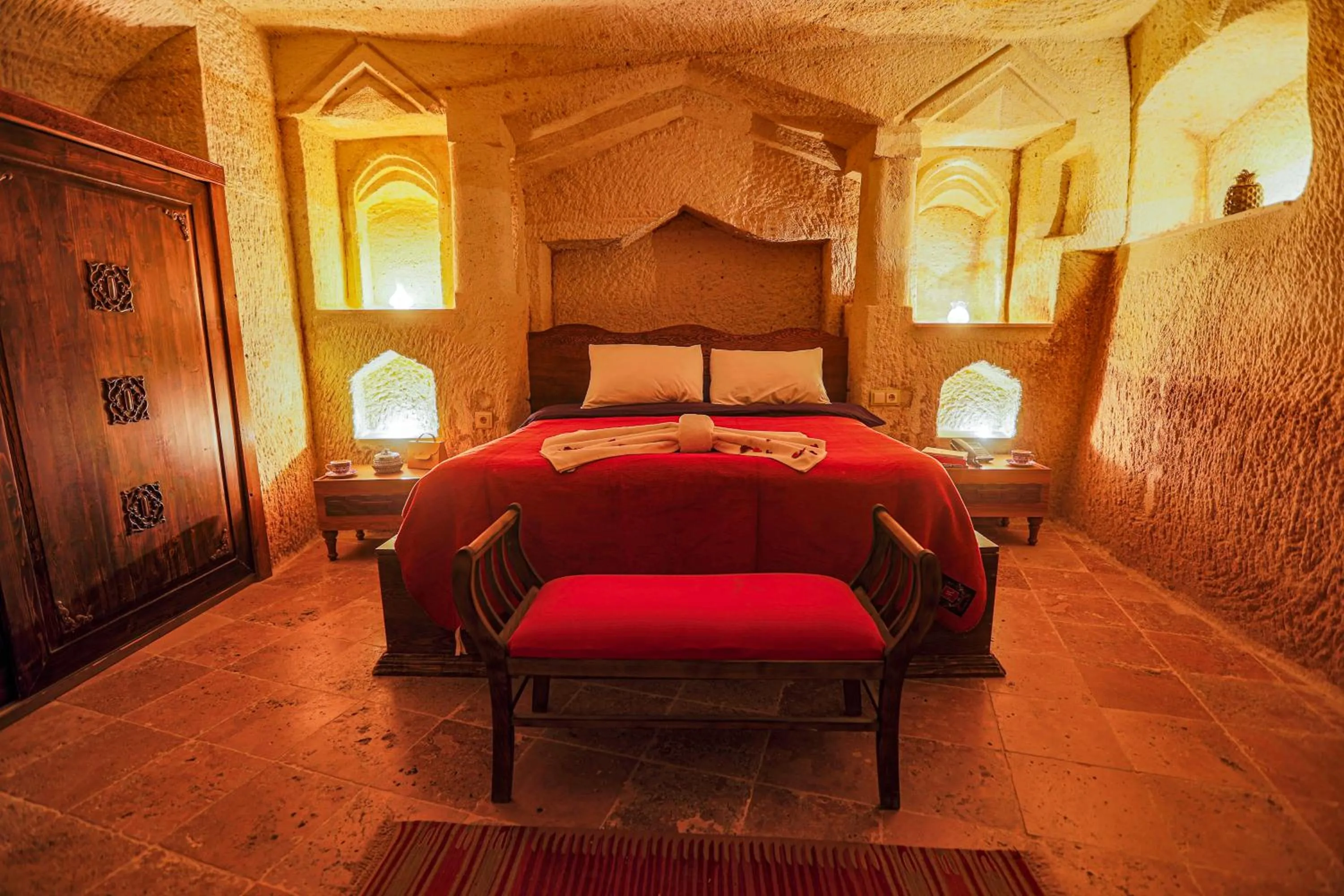 Bed in Sinasos Palace Cave Hotel