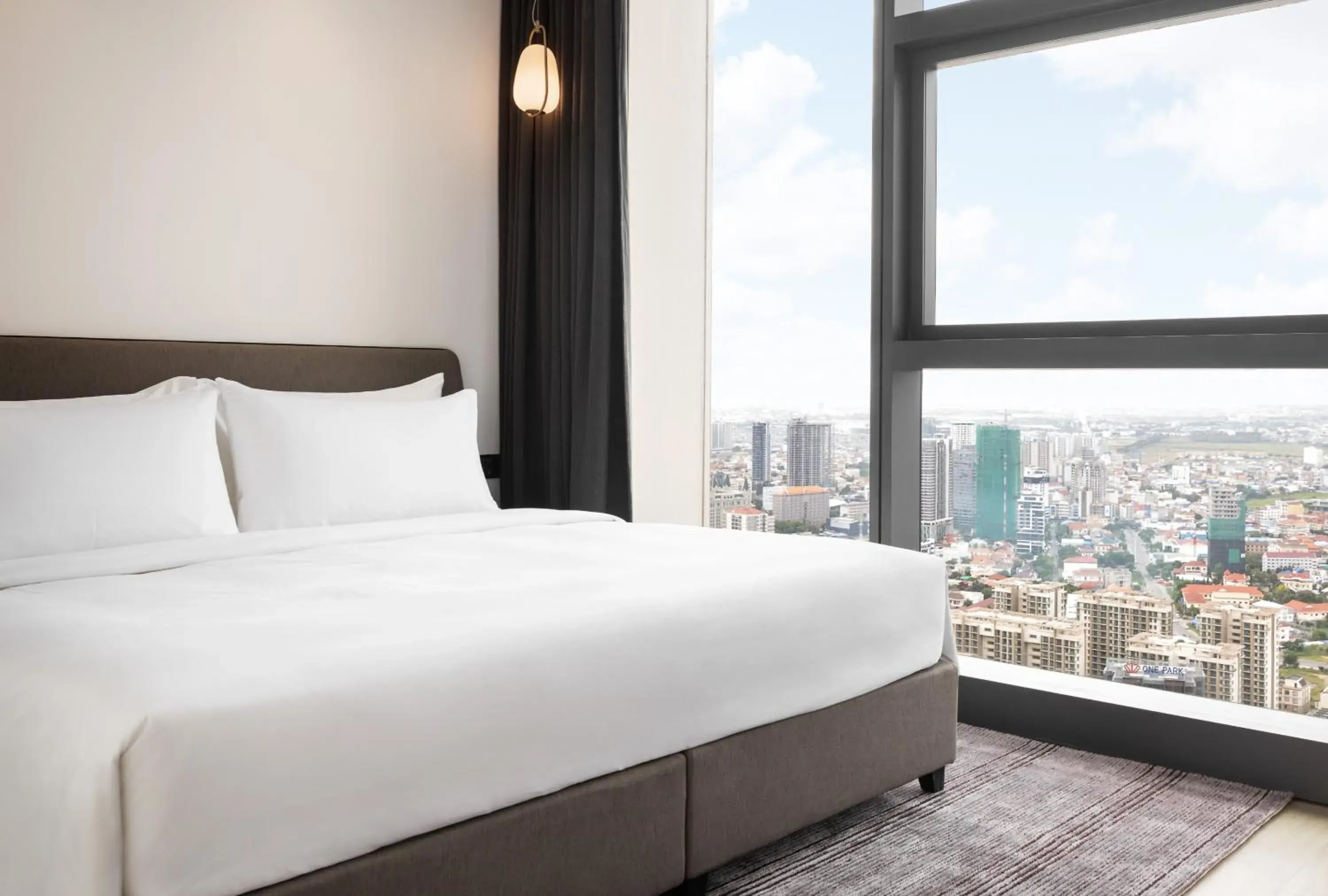 Bed in Citadines Flatiron Phnom Penh Bed in Citadines Flatiron Phnom Penh