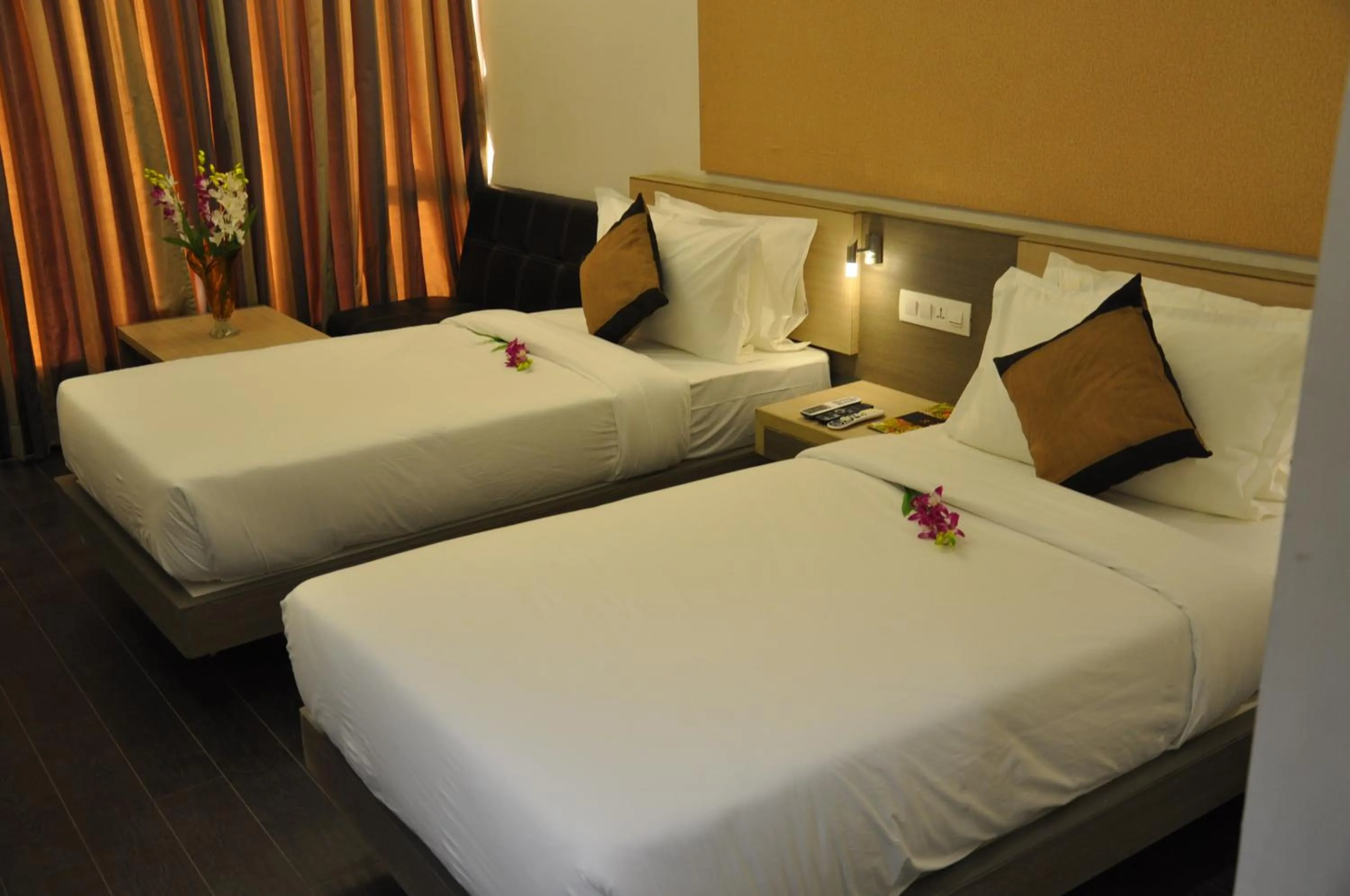 Photo of the whole room, Bed in Pride Biznotel Manjusar Vadodara Near Sokhda Lake