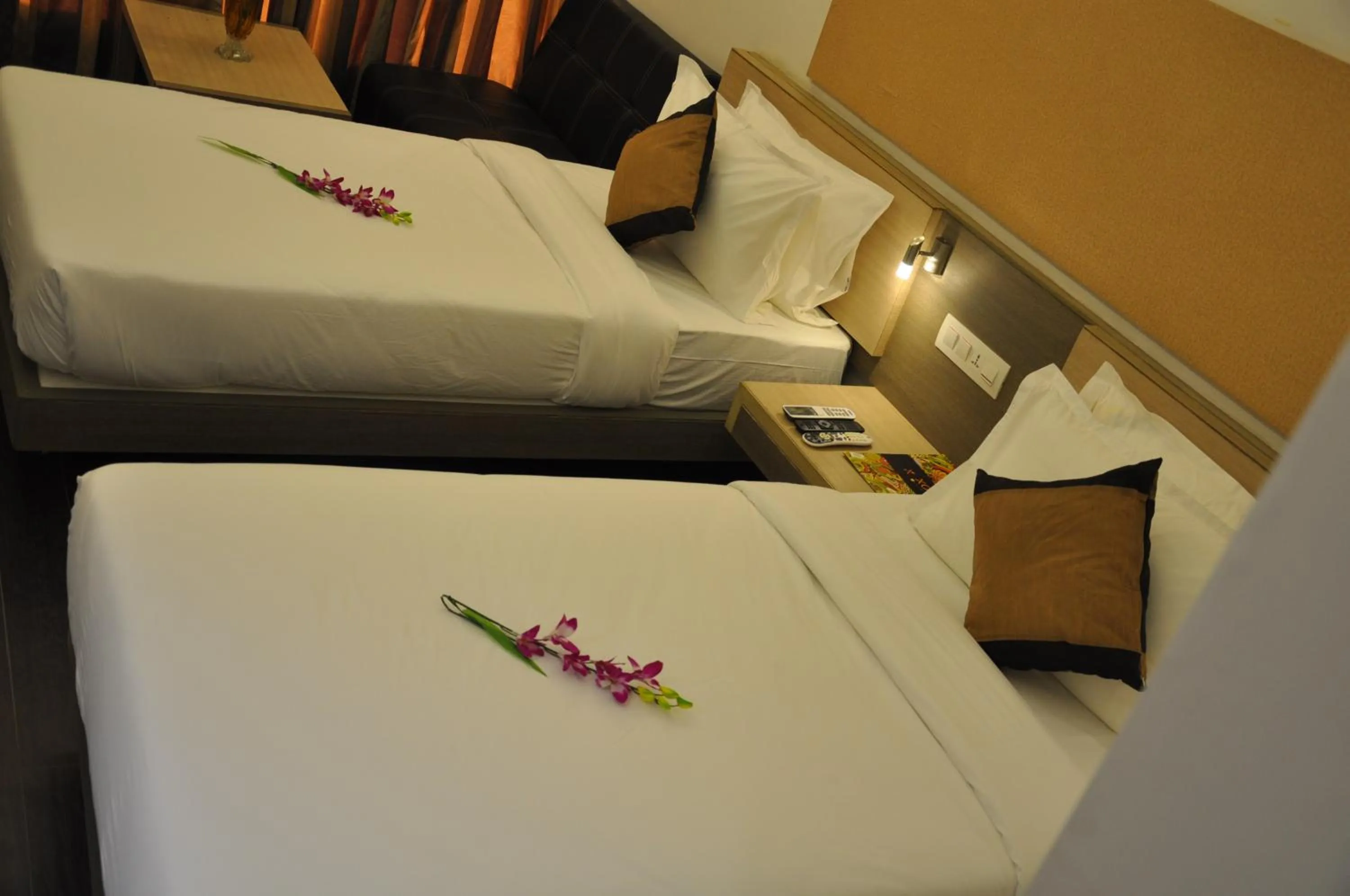 Photo of the whole room, Bed in Pride Biznotel Manjusar Vadodara Near Sokhda Lake