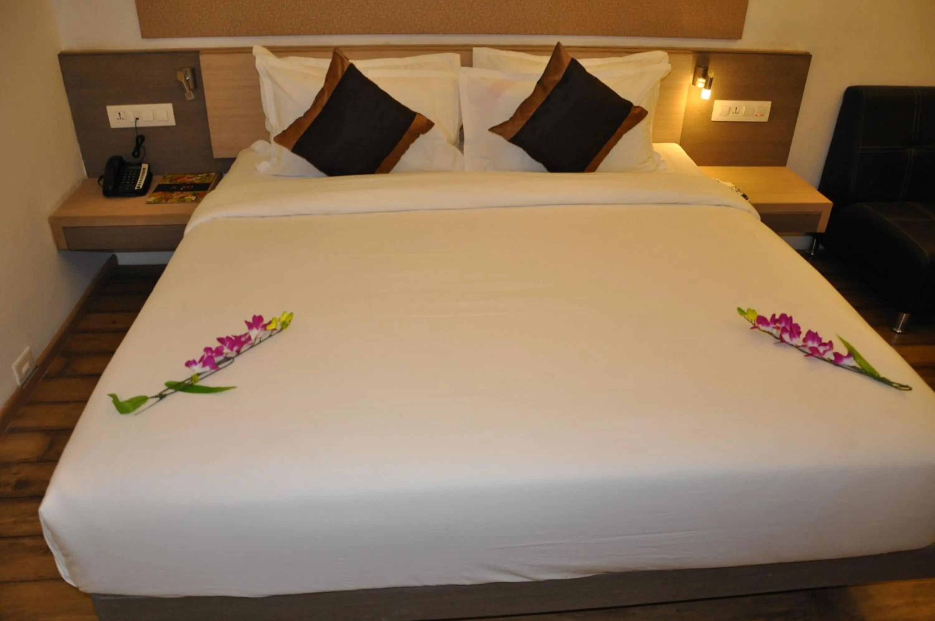 Bed in Pride Biznotel Manjusar Vadodara Near Sokhda Lake