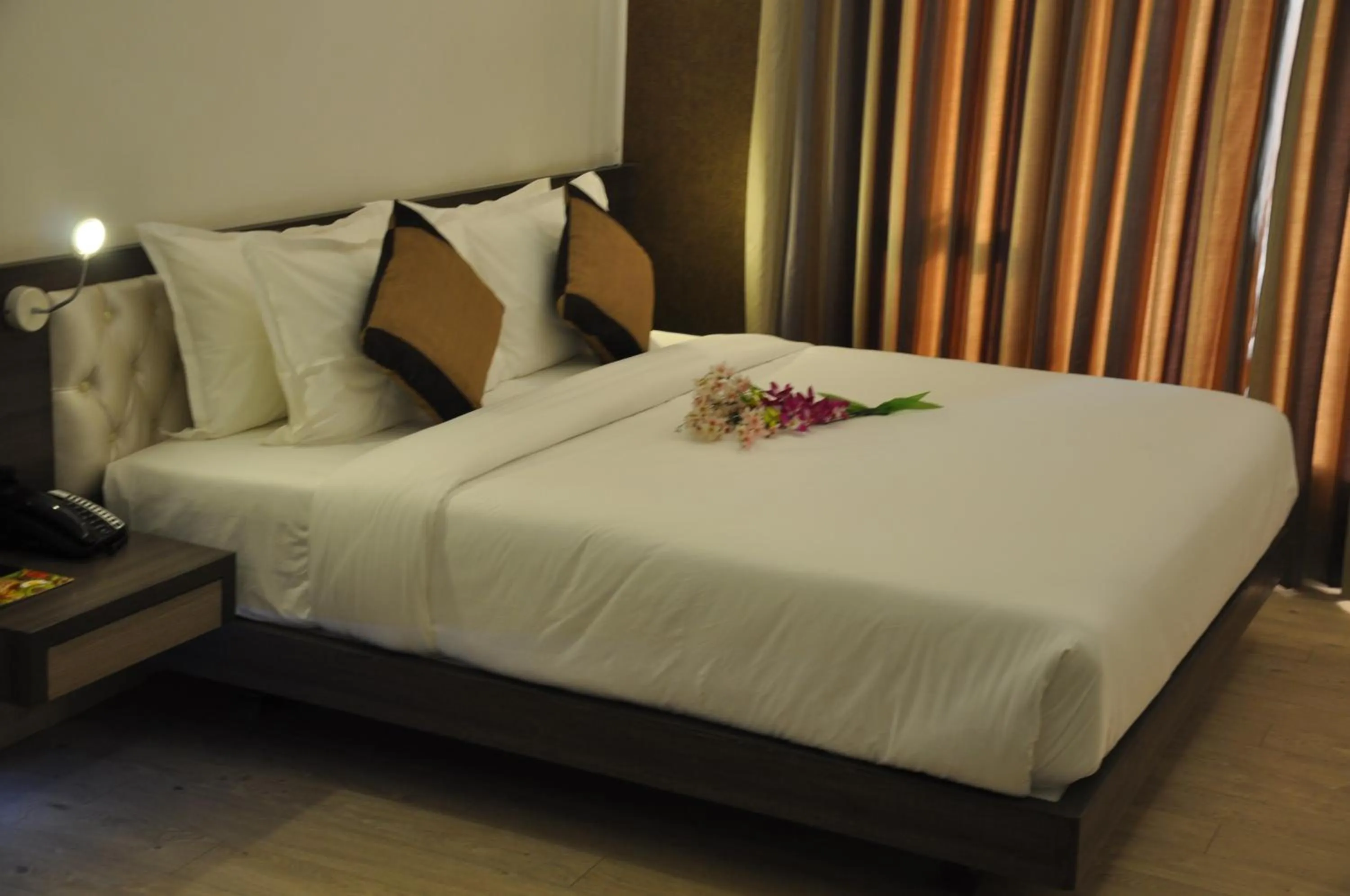 Photo of the whole room, Bed in Pride Biznotel Manjusar Vadodara Near Sokhda Lake