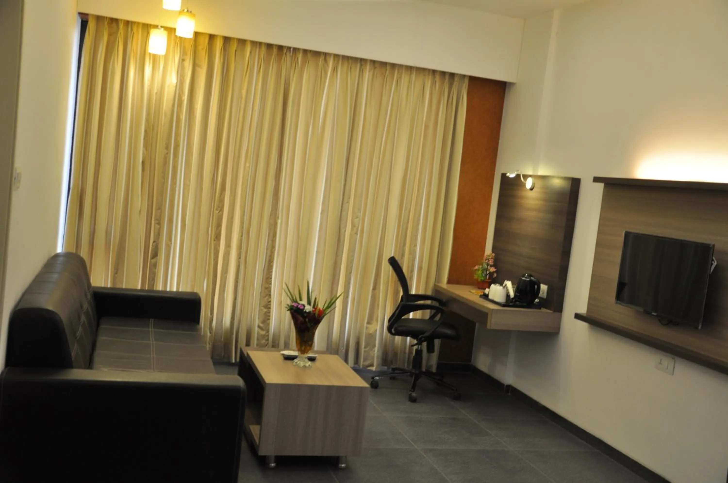 Living room in Pride Biznotel Manjusar Vadodara Near Sokhda Lake