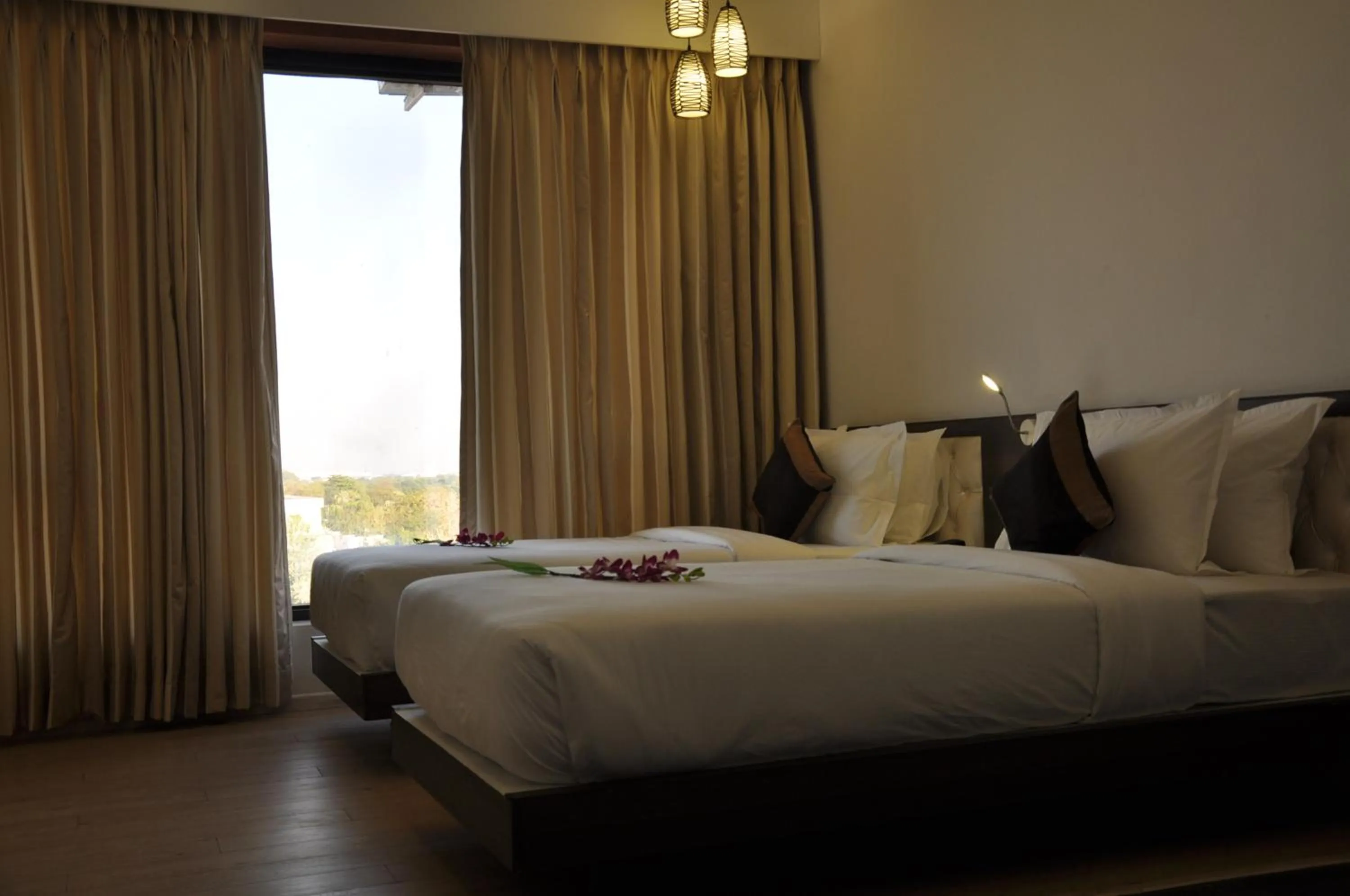 Bed in Pride Biznotel Manjusar Vadodara Near Sokhda Lake