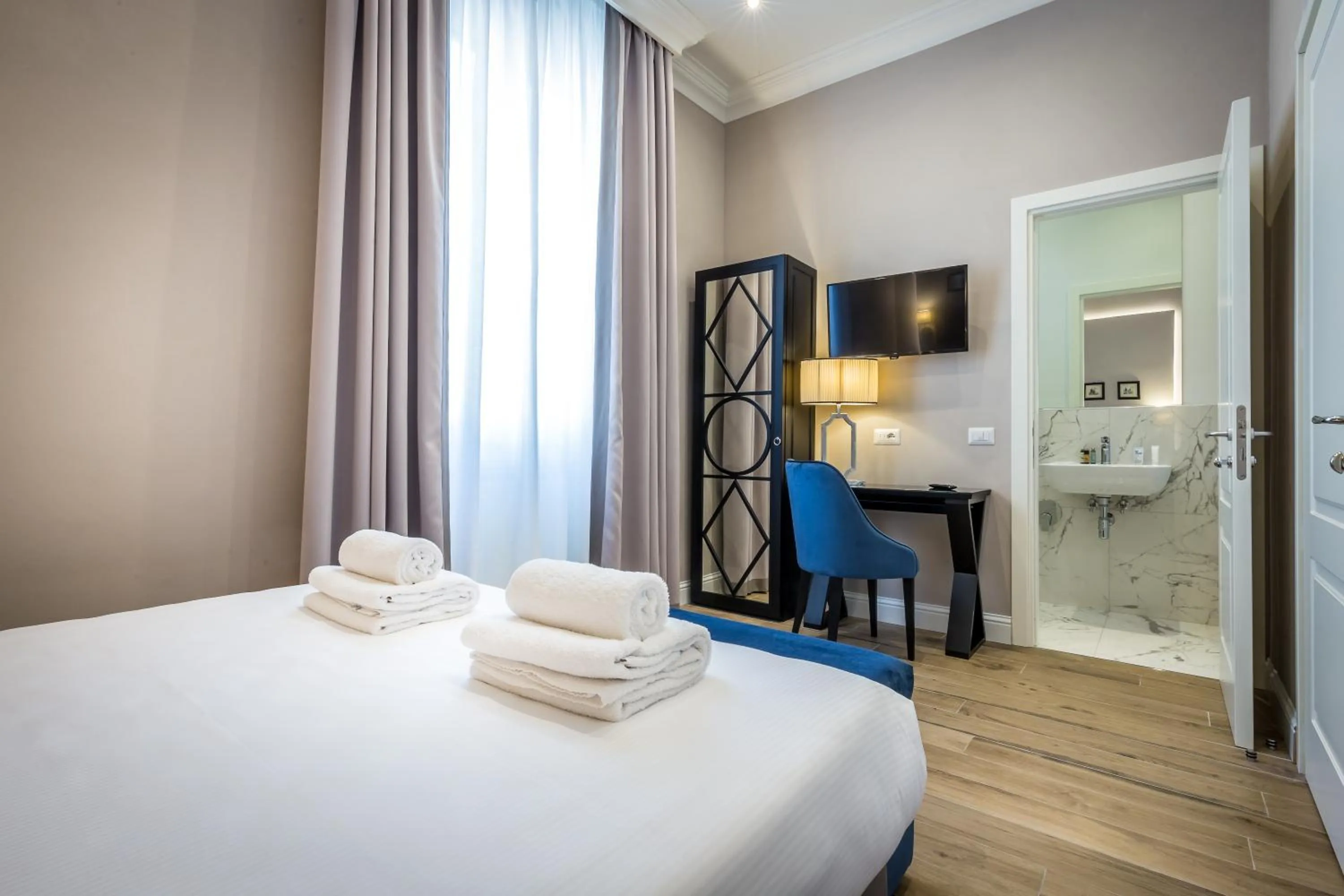 Bed in Hotel Emma Small Luxury Hotel