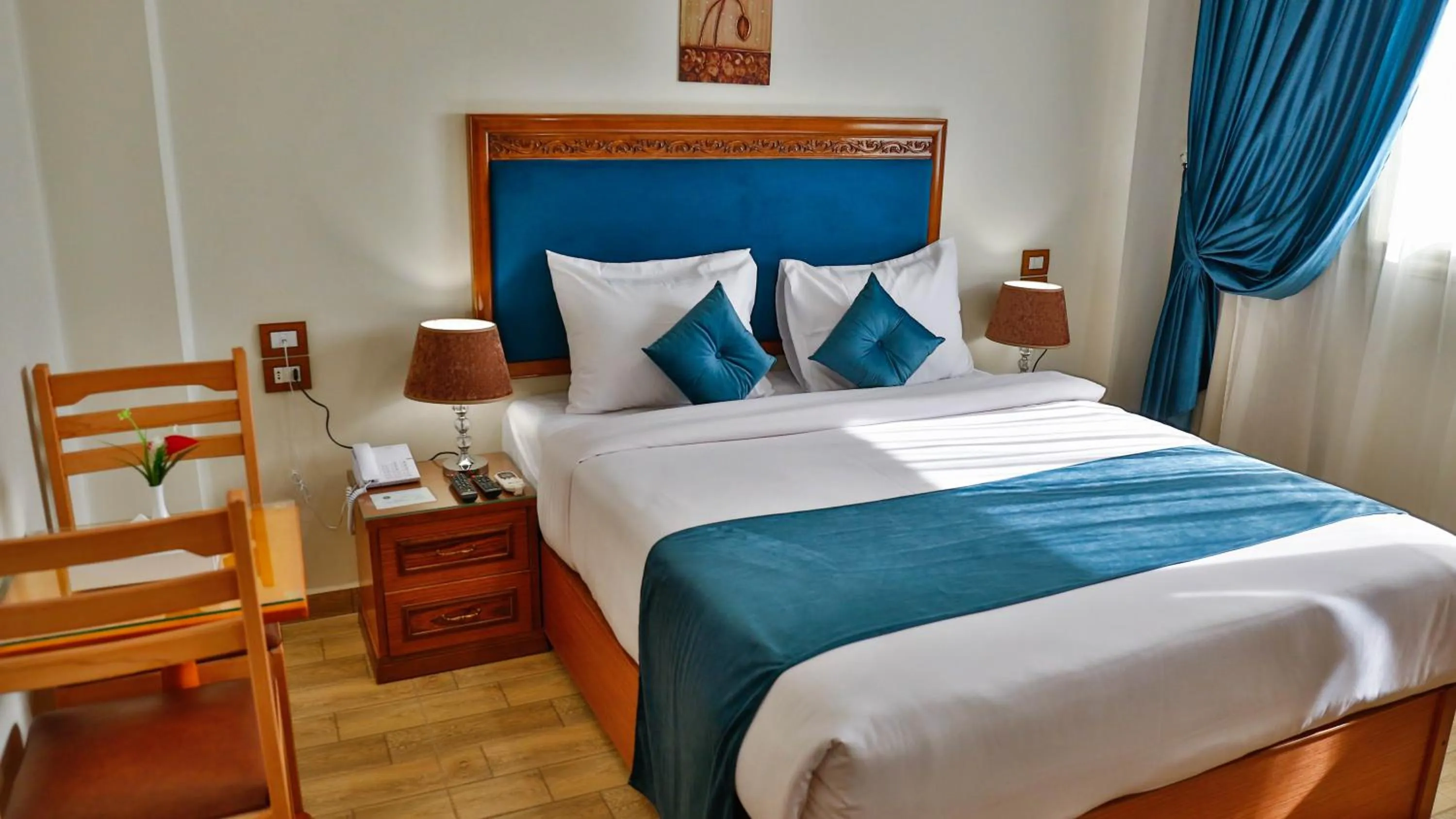 Bed in The Palm Hotel