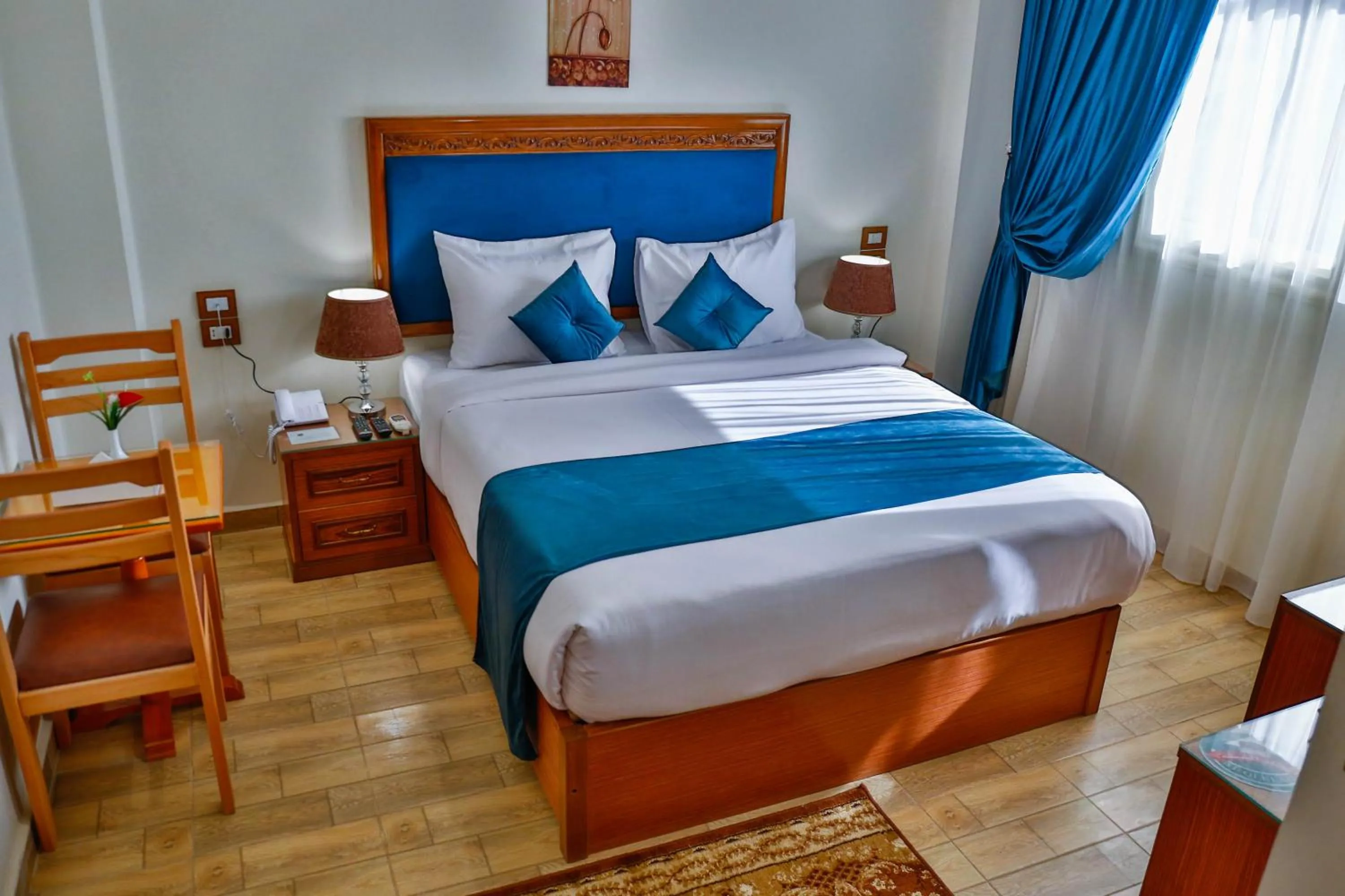 Bed in The Palm Hotel