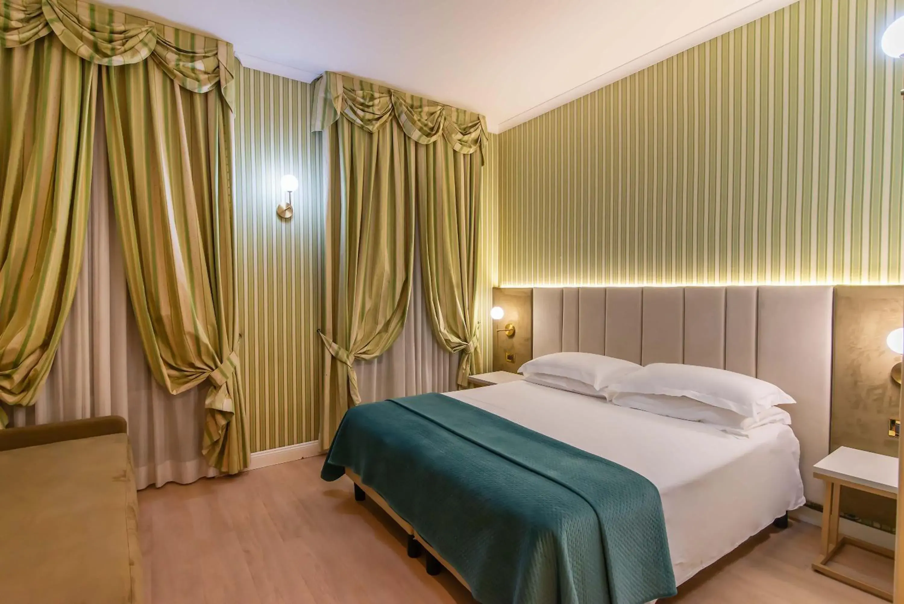 Bed in Gambrinus Hotel Bed in Gambrinus Hotel