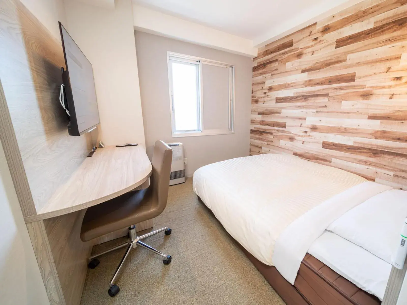 Bed in Super Hotel Kushiro-Ekimae Bed in Super Hotel Kushiro-Ekimae