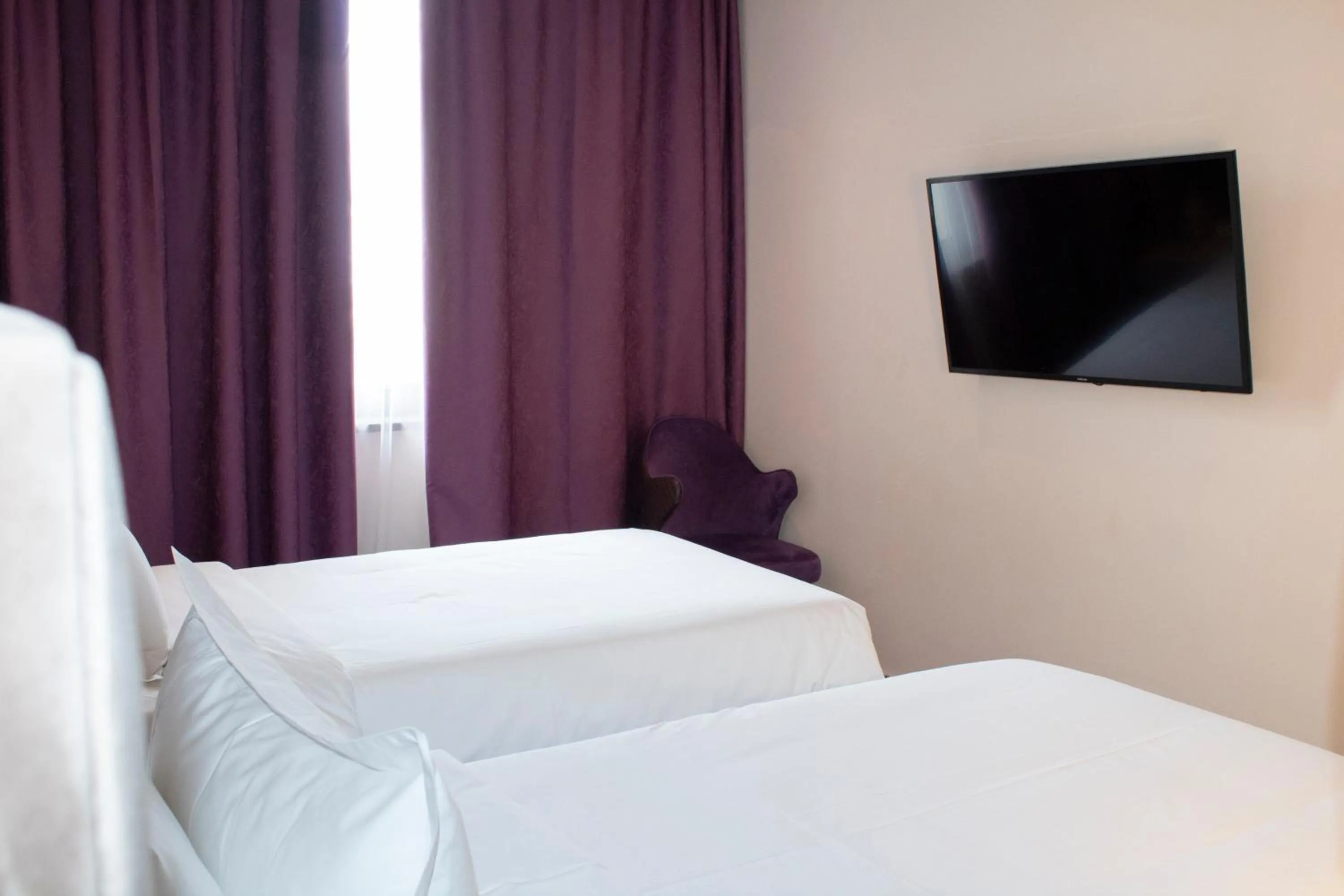 Photo of the whole room, Bed in Orient Hotel Bishkek