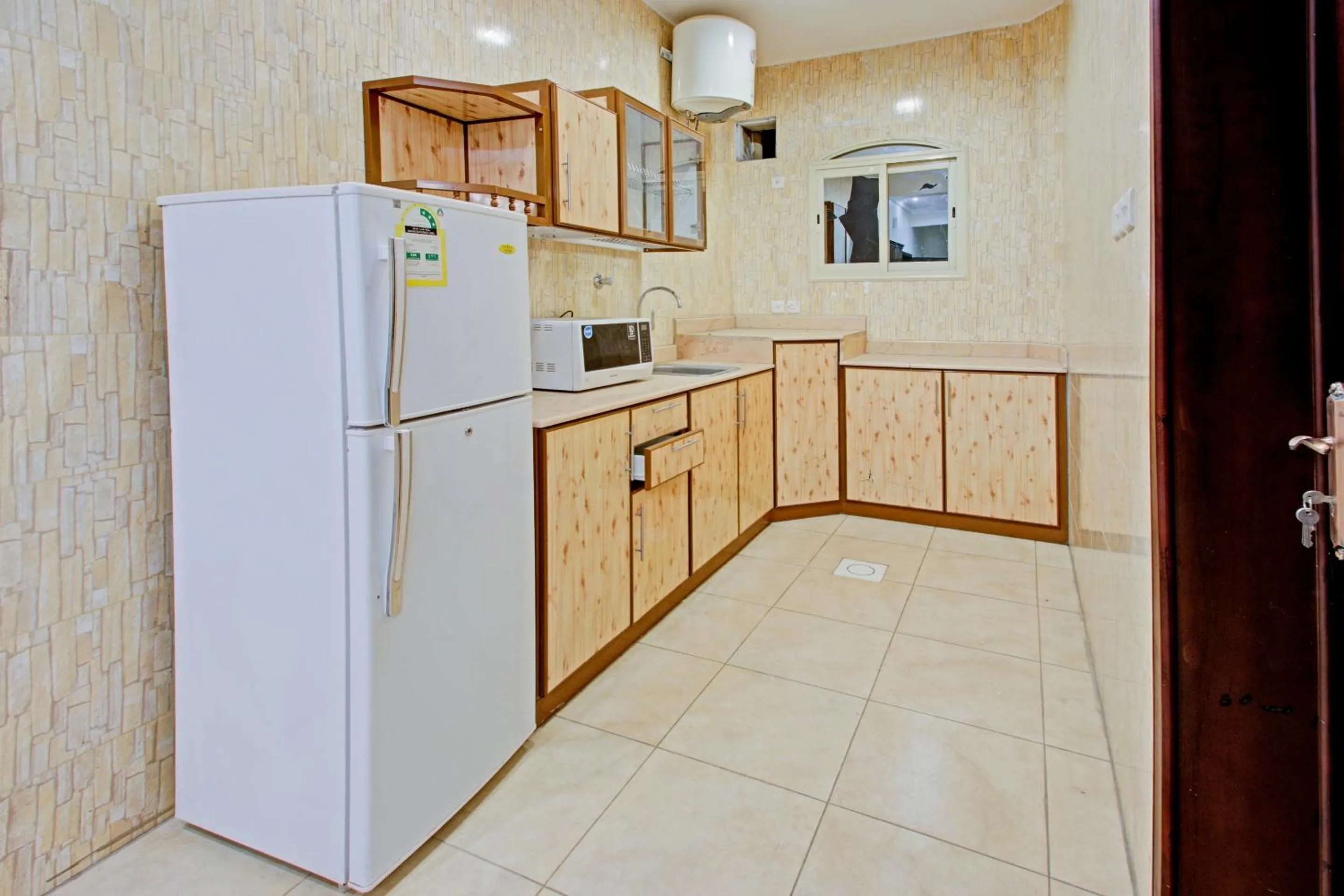 Kitchen or kitchenette, Kitchen/Kitchenette in OYO 601 Ibs For Residential Units