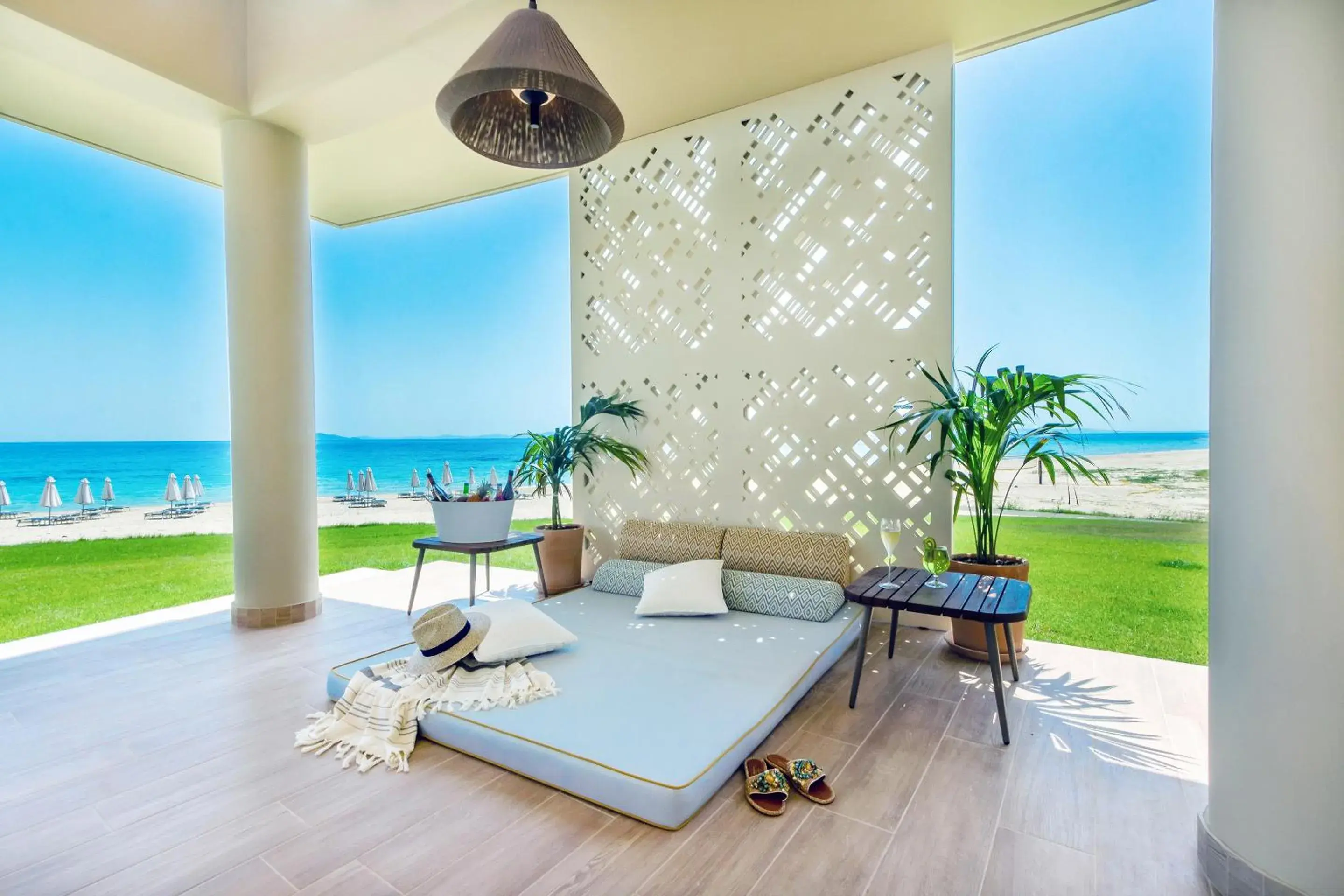 Seating area, Bed in Ammoa Luxury Hotel & Spa Resort Seating area, Bed in Ammoa Luxury Hotel & Spa Resort