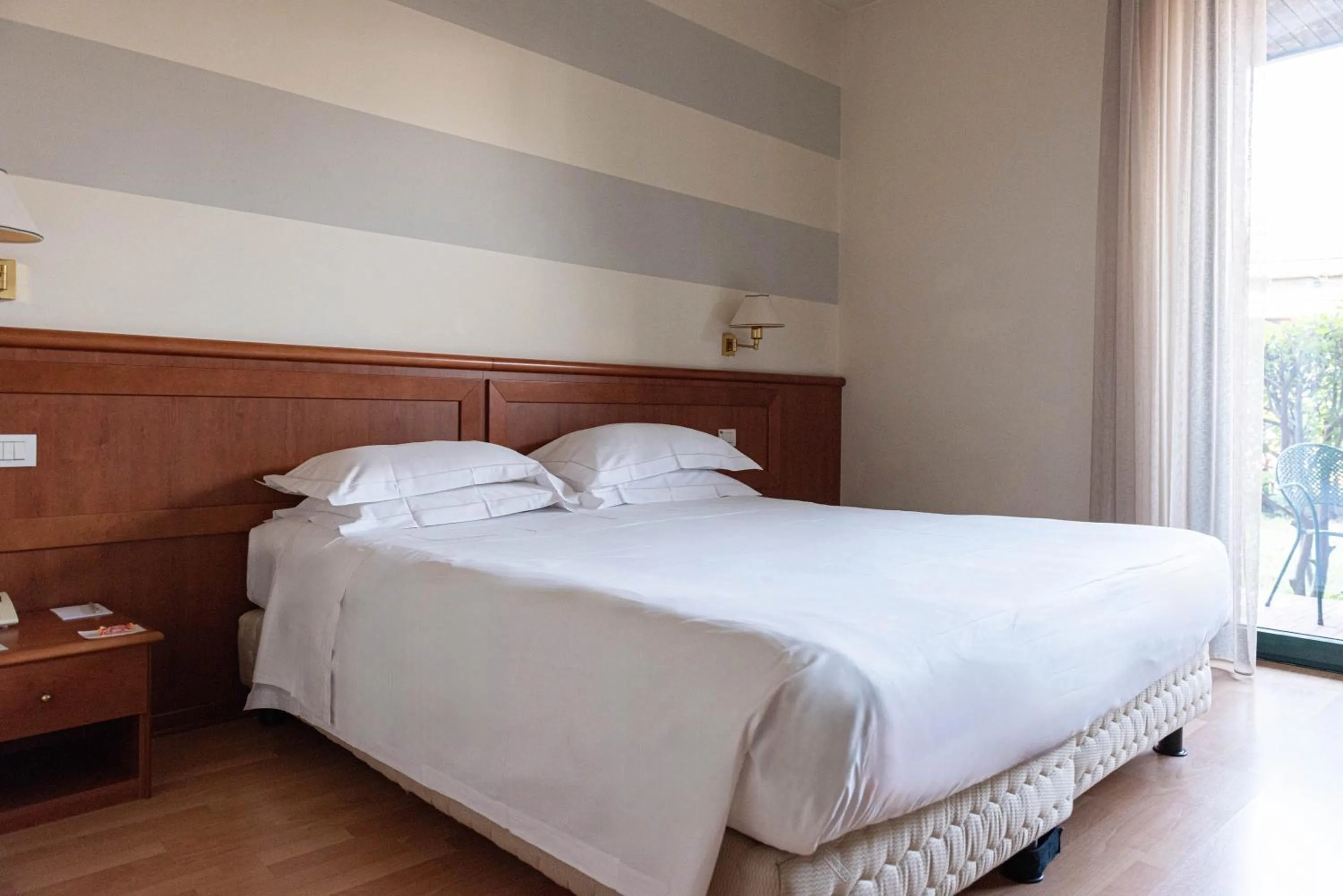 Bed in Phi Hotel Emilia