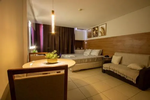 Suíte luxo com tela de cinema no América Towers Studio Residence