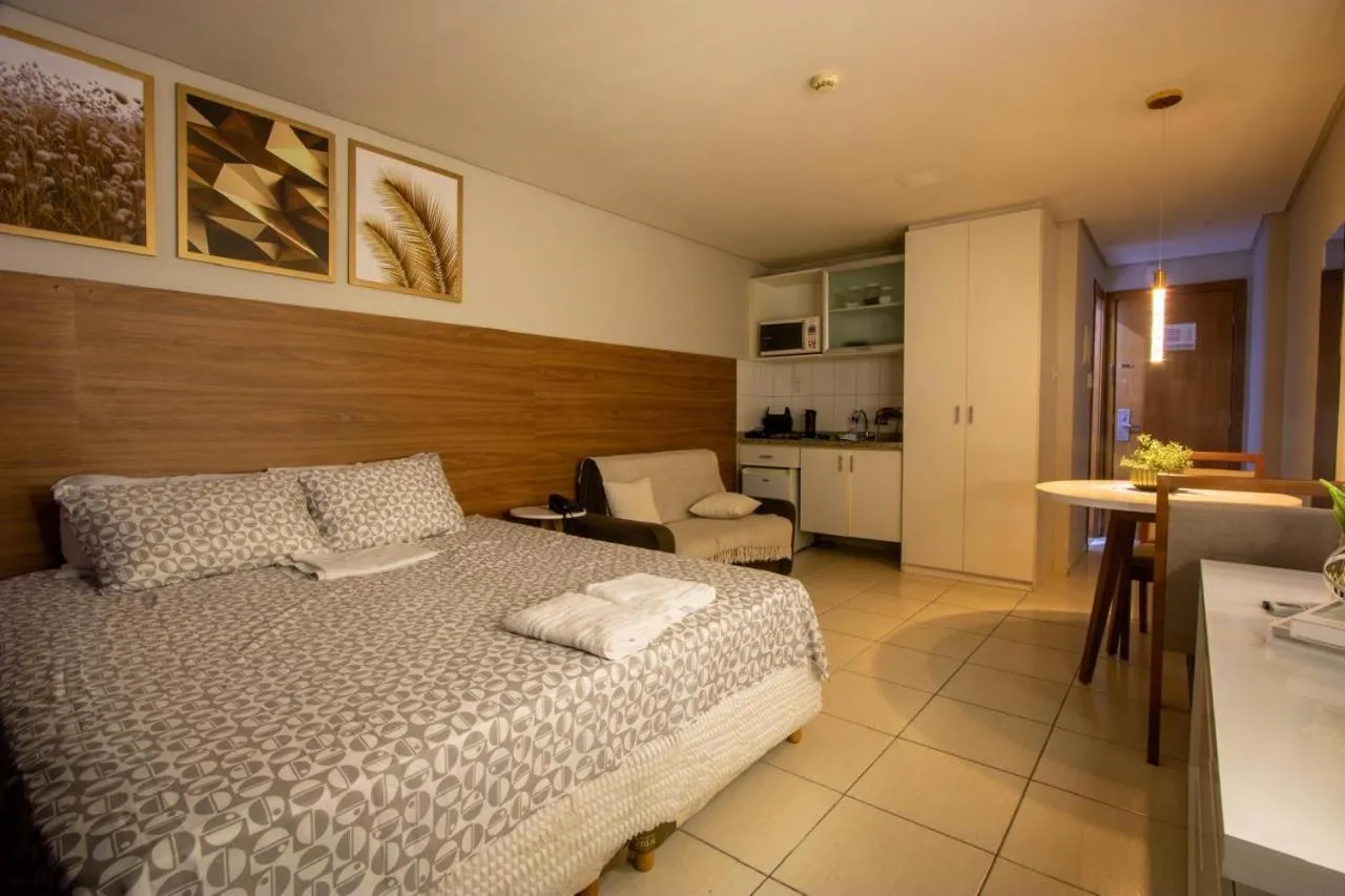 Bed in Suíte luxo com tela de cinema no América Towers Studio Residence