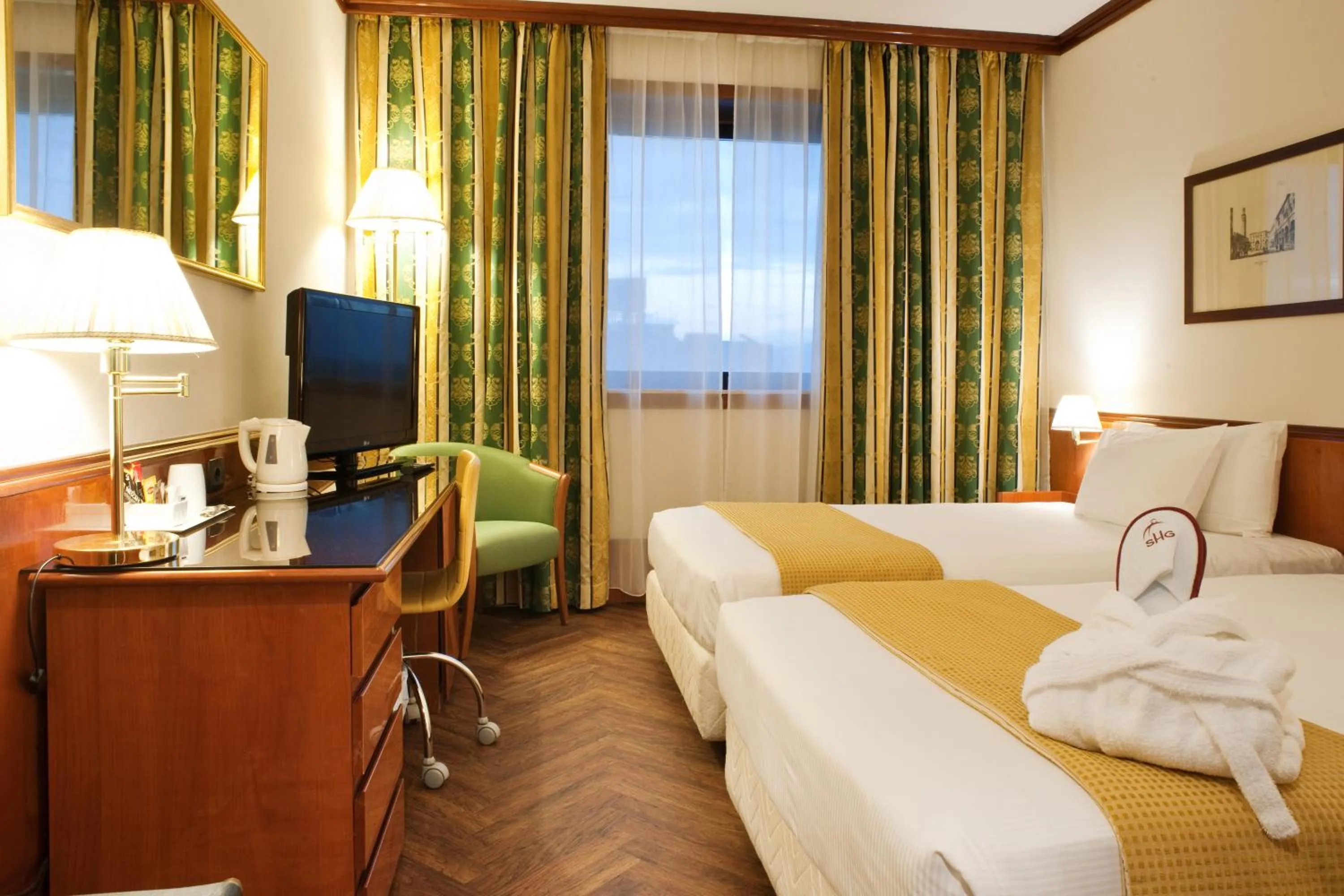 Bed in Hotel Catullo