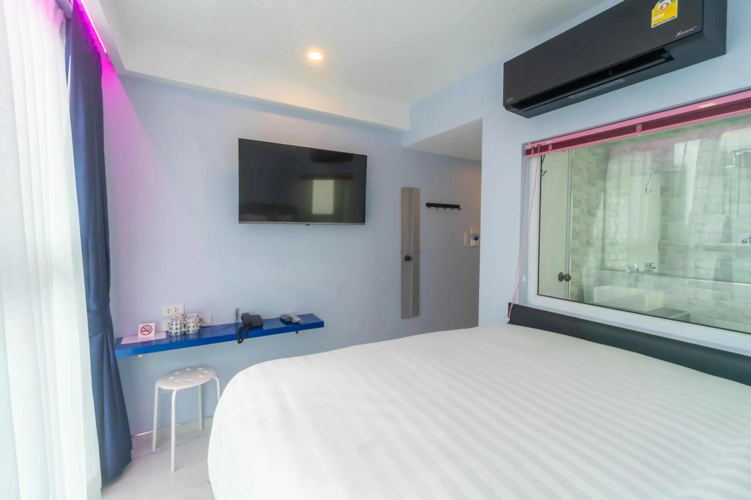 Bedroom, Bed in Spark Hotel - MRT Queen Sirikit - SHA Extra Plus Certified