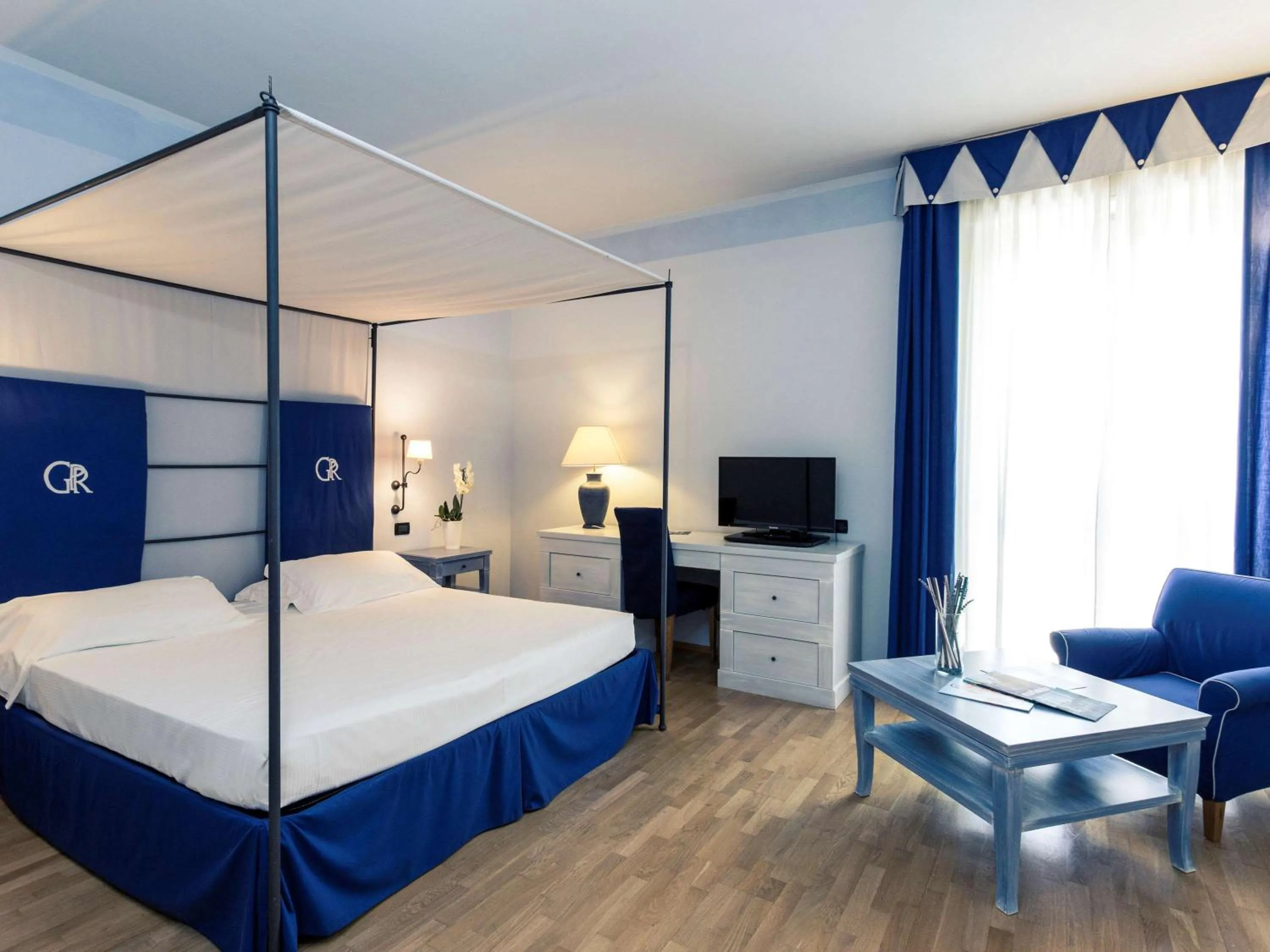 Photo of the whole room, Bed in TH Tirrenia - Green Park Resort