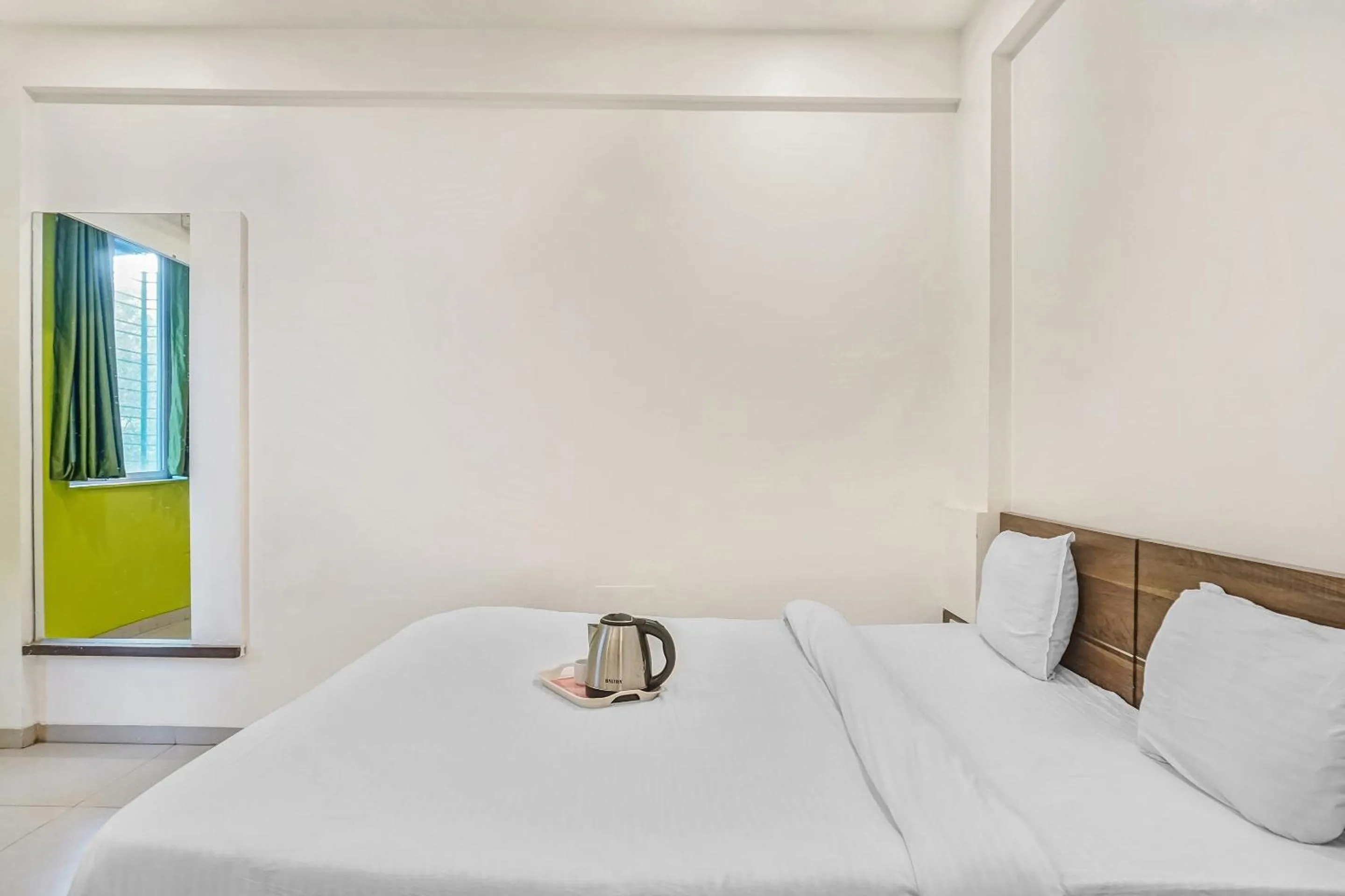 Bedroom, Bed in Super Townhouse The Upper Room Near Pune Airport