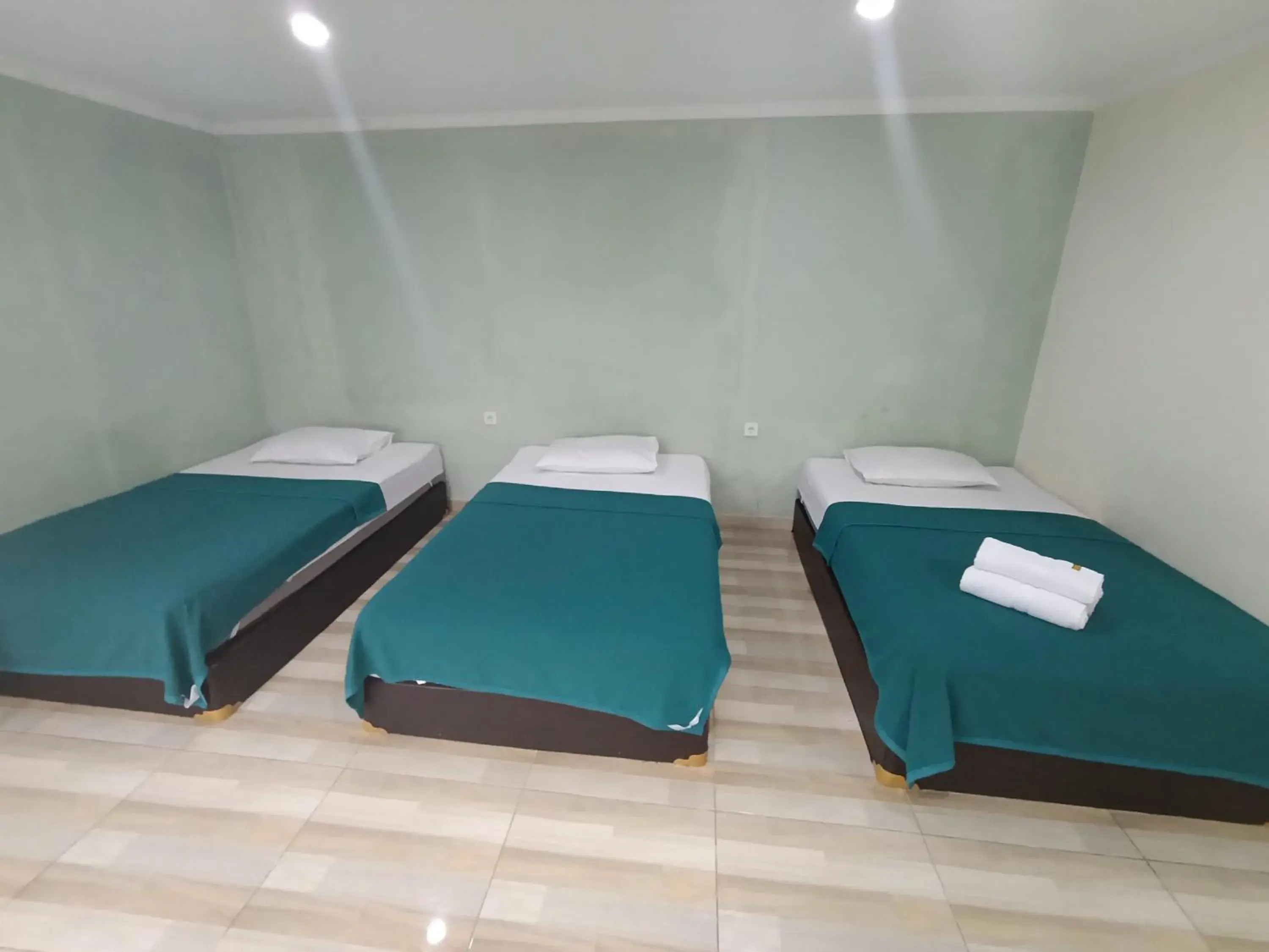 Bed in Mamifokobo Guest House Bed in Mamifokobo Guest House