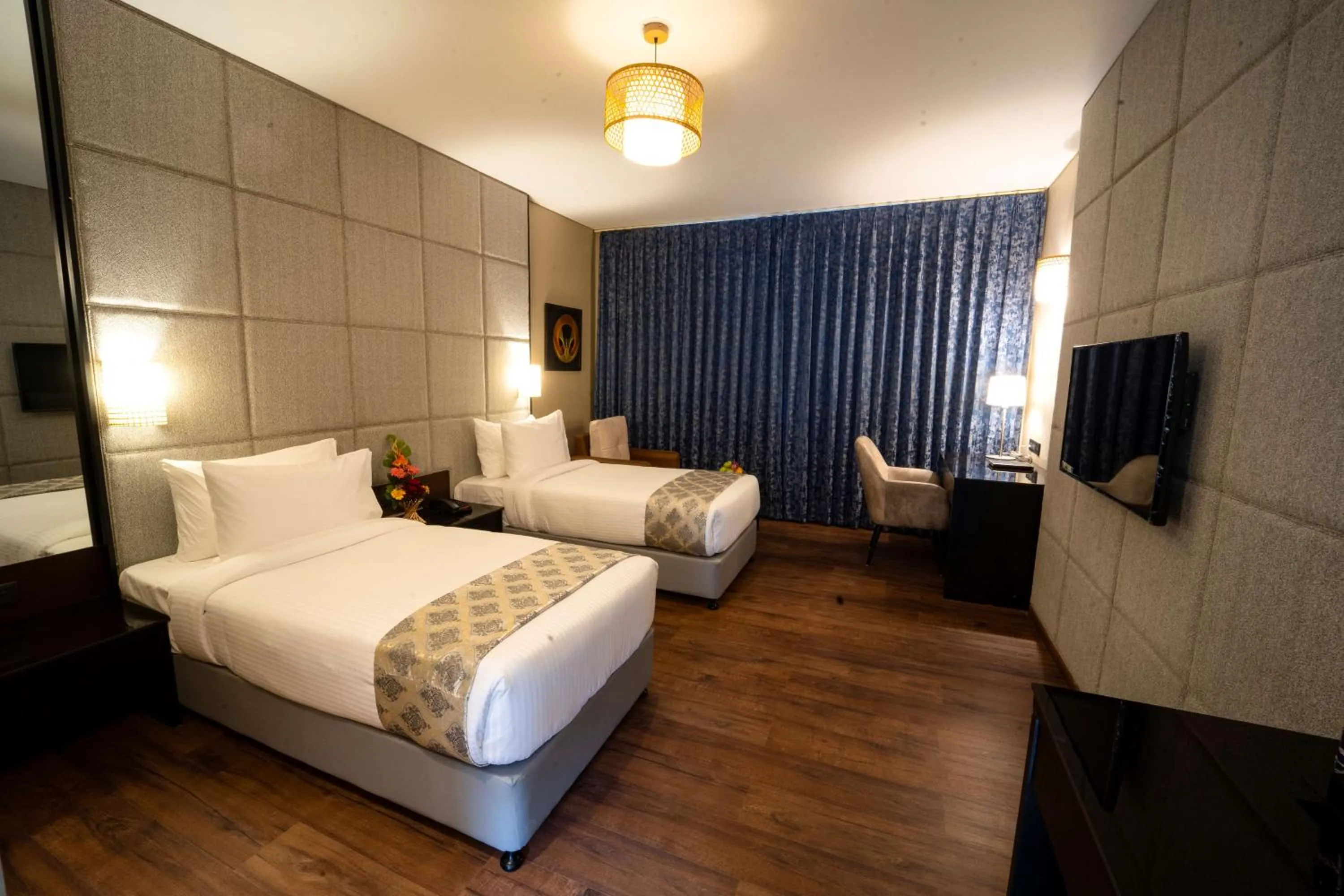 Bed in Essentia Luxury Hotel Indore