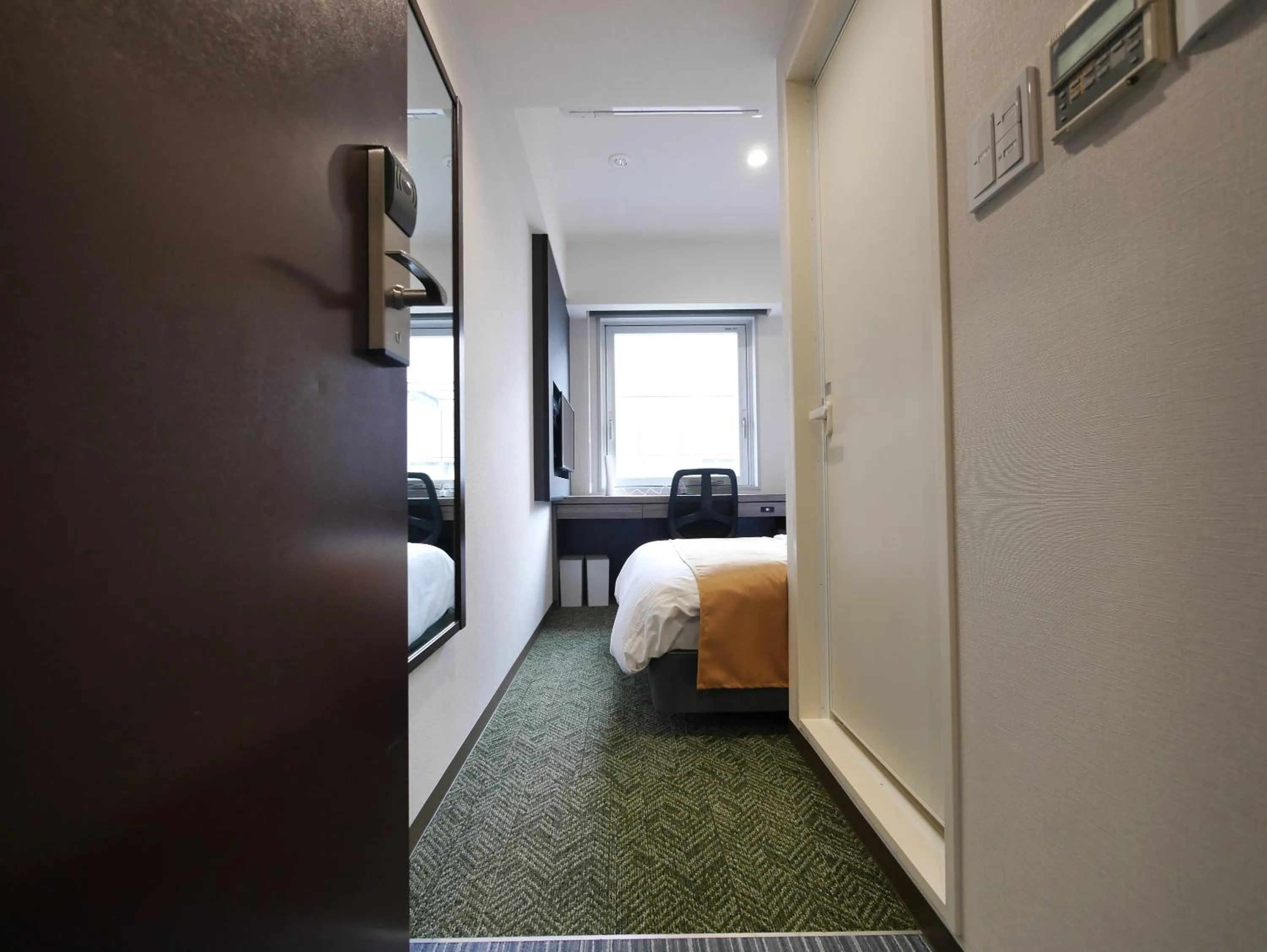 View (from property/room), Bed in Hotel Comfybed Ginza