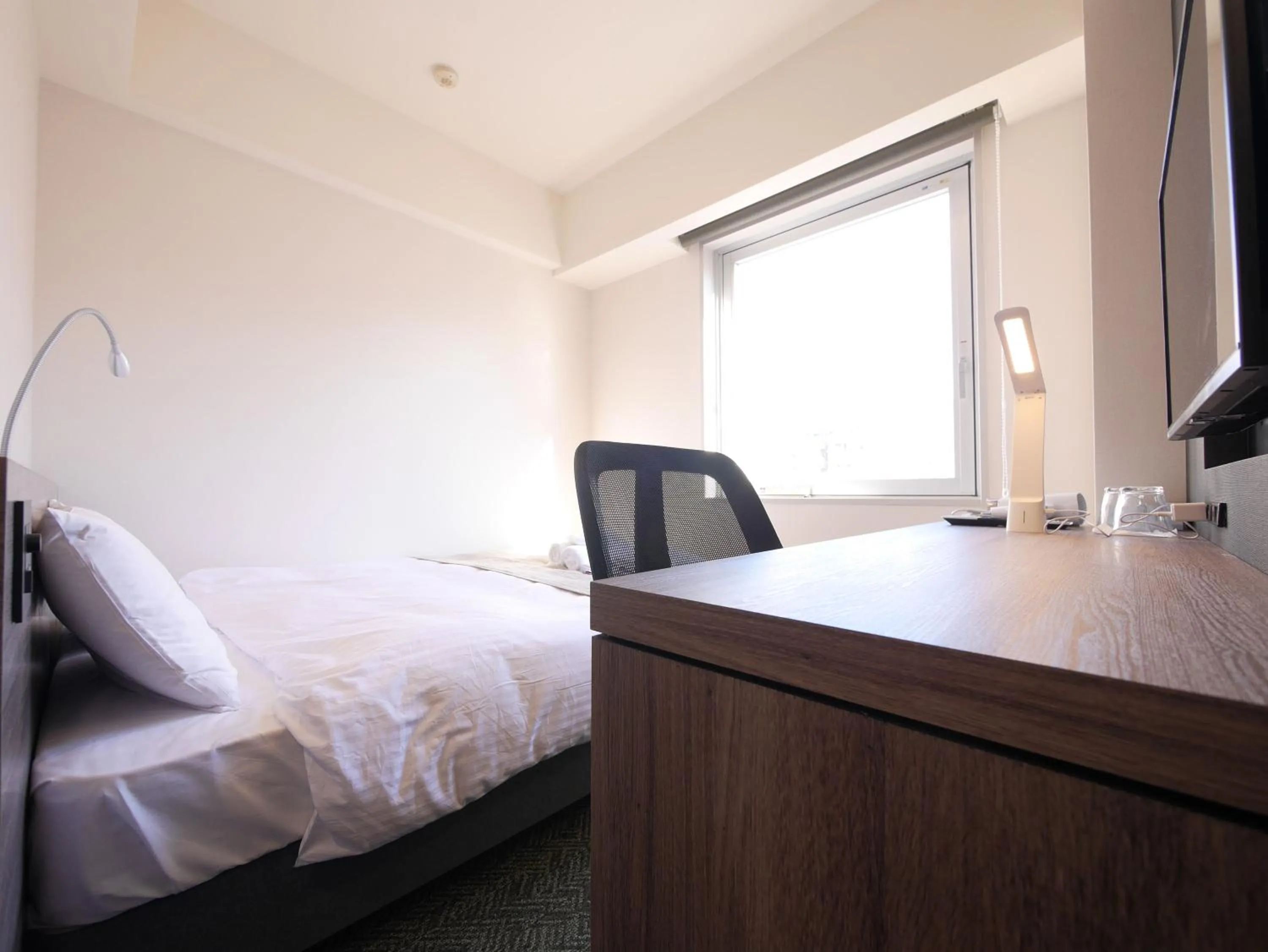 View (from property/room), Bed in Hotel Comfybed Ginza