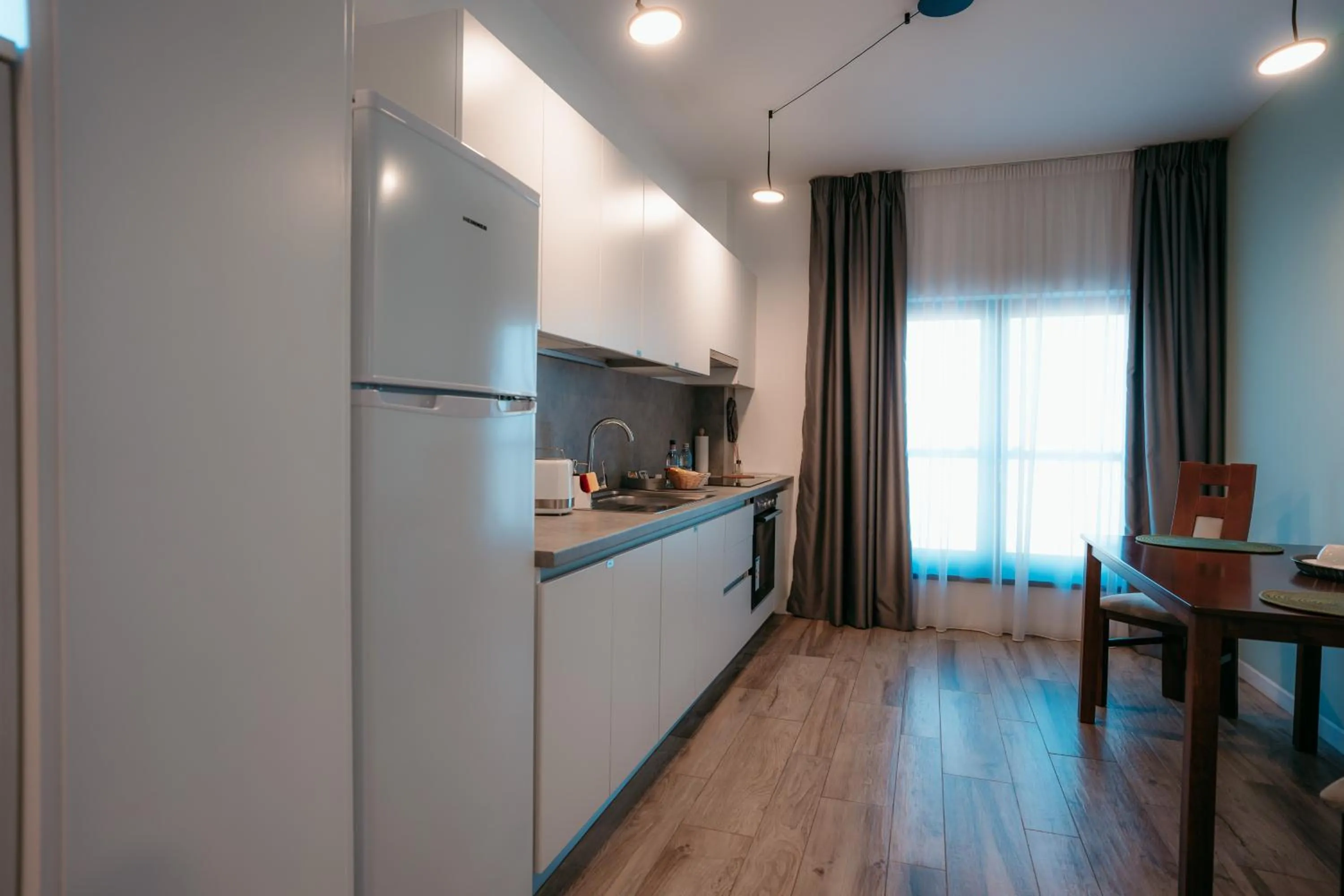 Kitchen or kitchenette in ResHome Apartments&Rooms