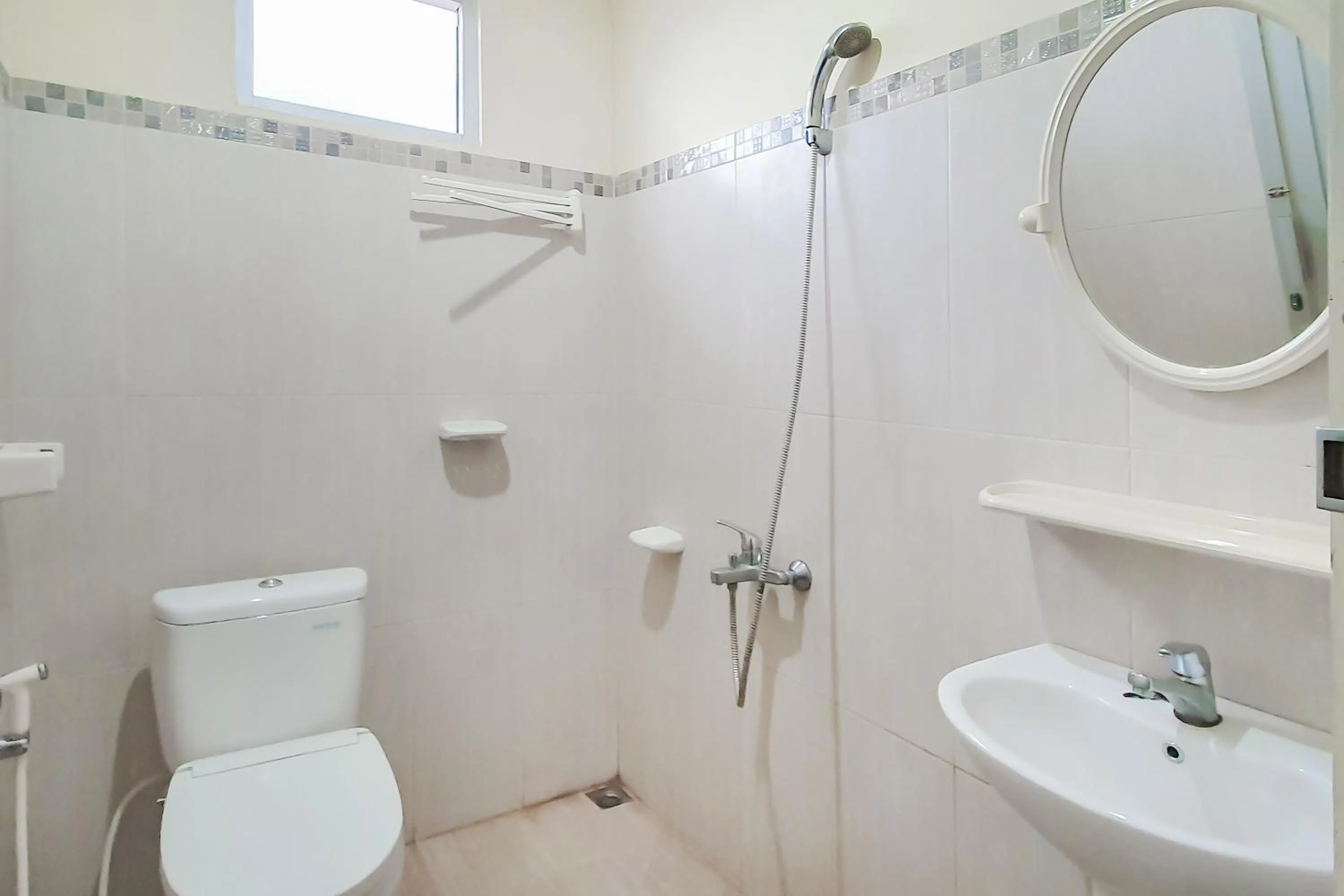 Bathroom in Urbanview Hotel Bartu Moh Toha Bandung by RedDoorz