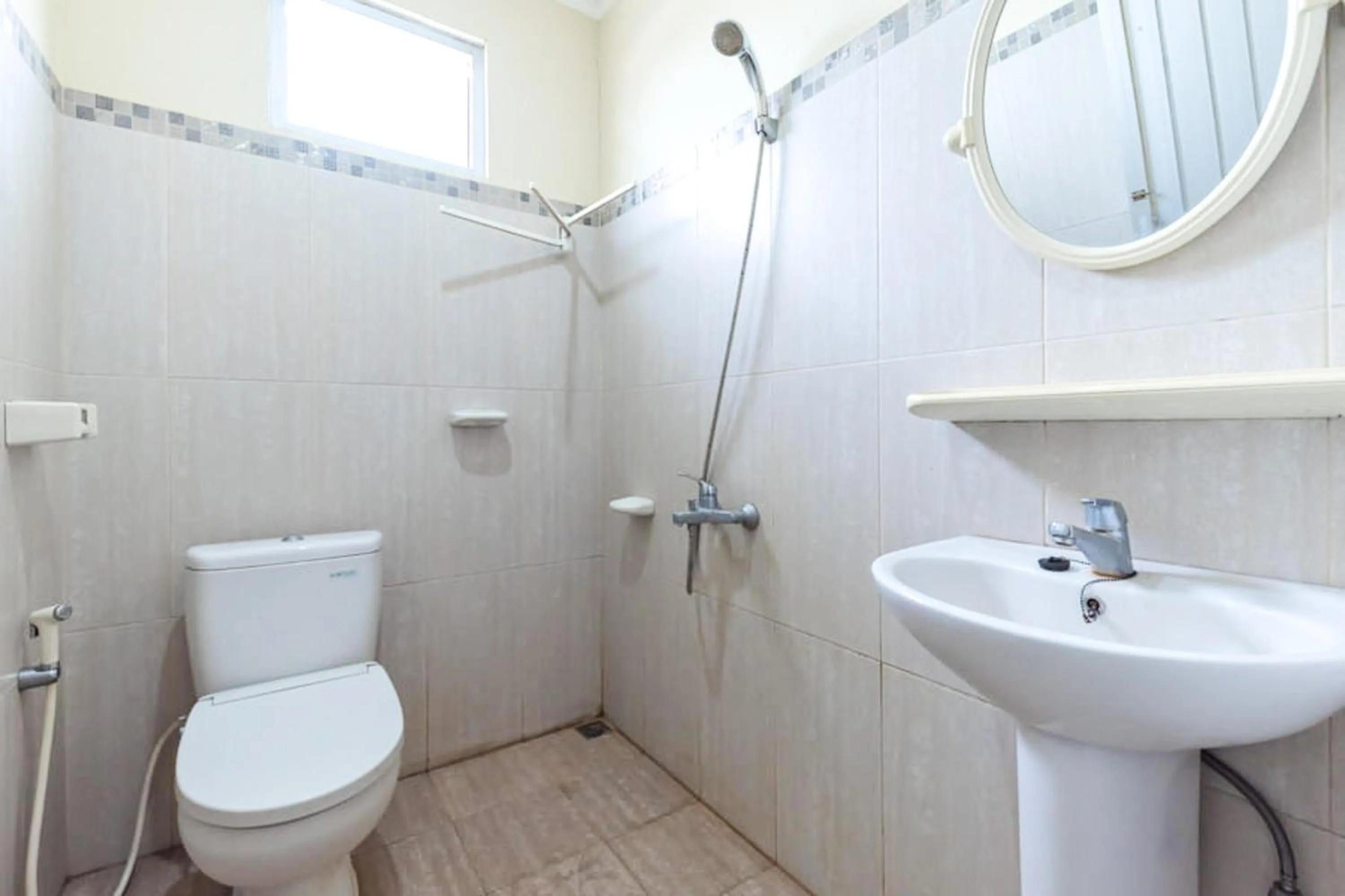 Bathroom in Urbanview Hotel Bartu Moh Toha Bandung by RedDoorz