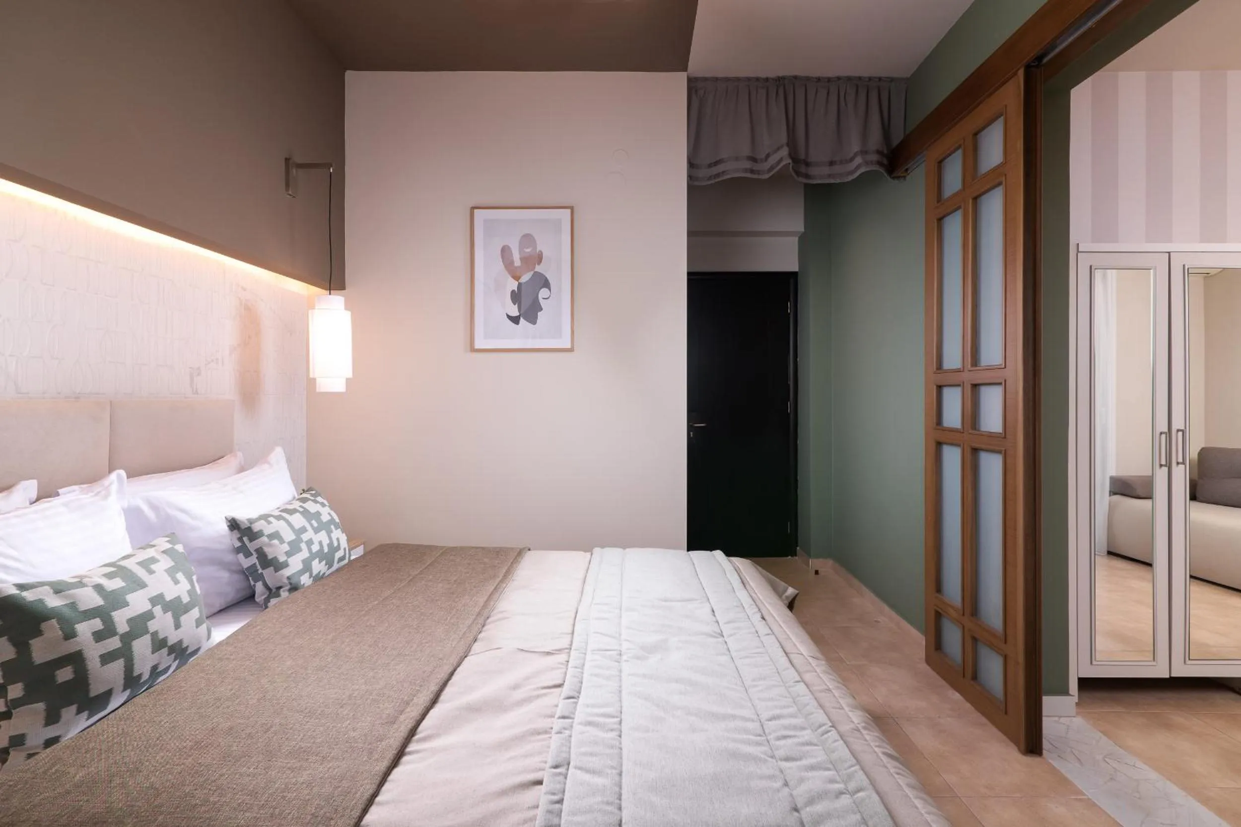 Bed in ELLE Rooms & Suites